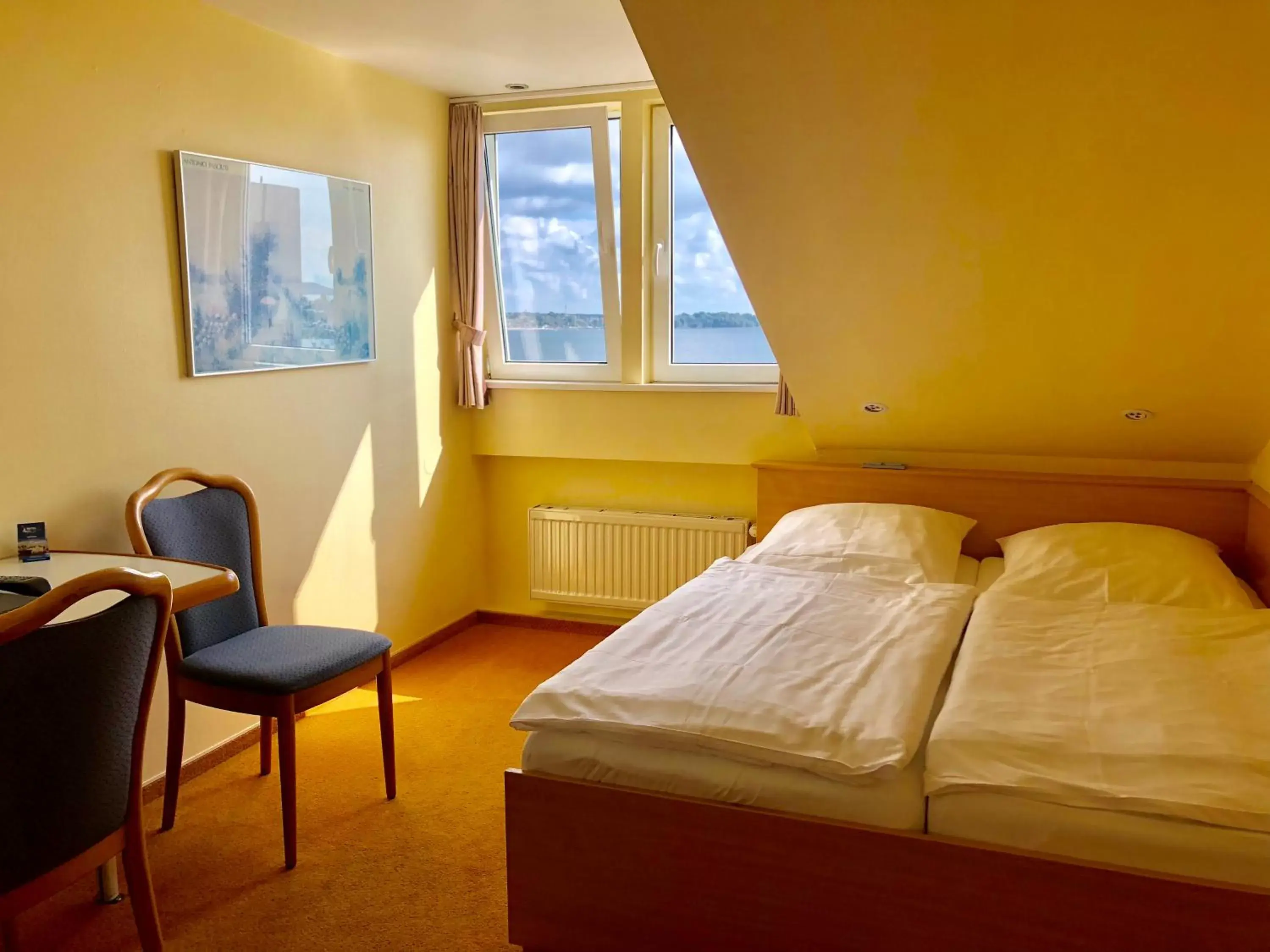 Photo of the whole room, Bed in Hotel Kieler Förde