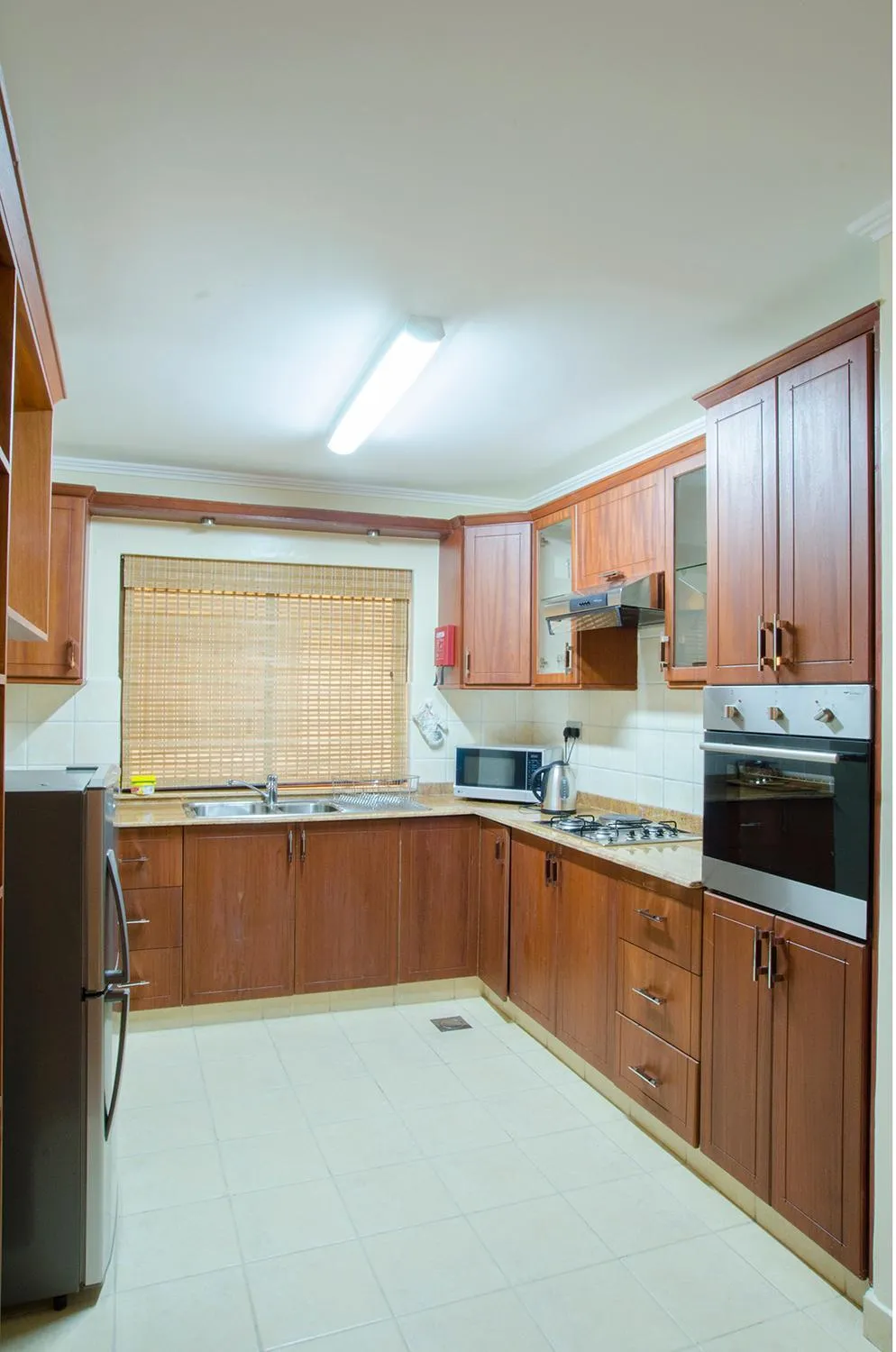 Kitchen or kitchenette in Waridi Paradise Hotel and Suites