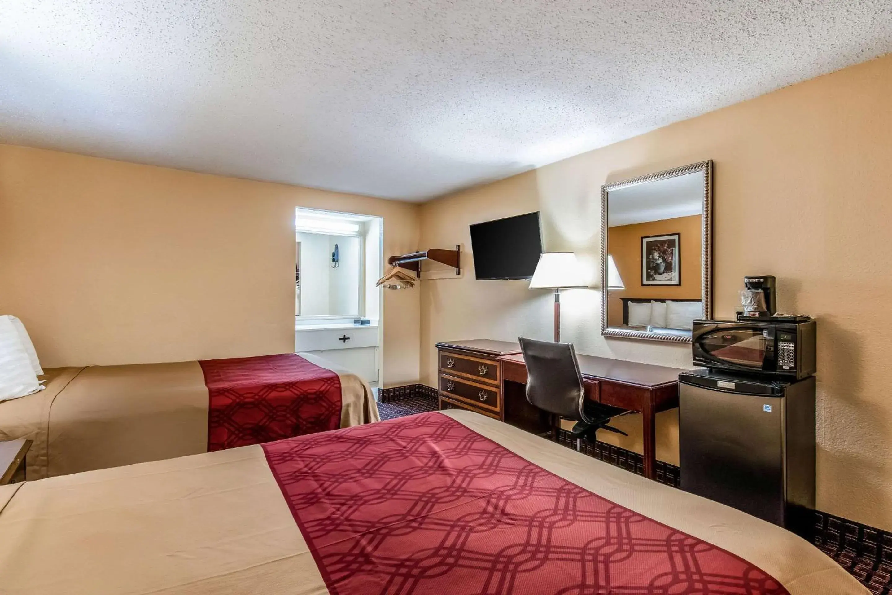 Photo of the whole room, TV/Entertainment Center in Rodeway Inn