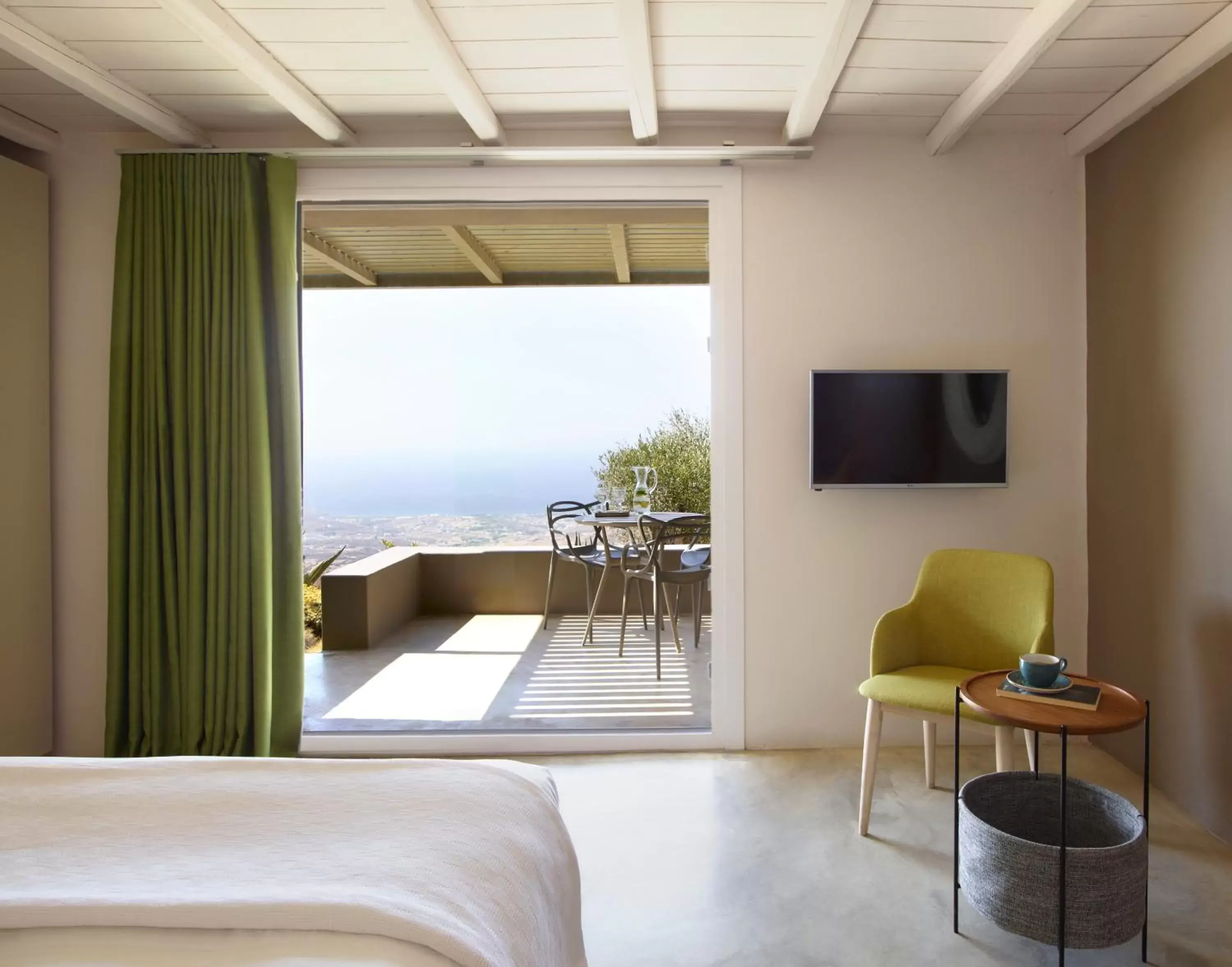 Bed, TV/Entertainment Center in Aeolis Tinos Suites