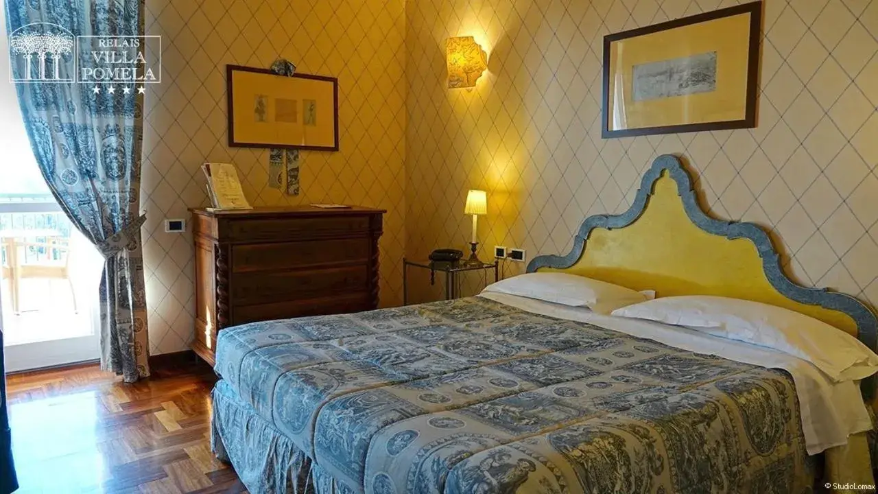 Bed in Relais Villa Pomela