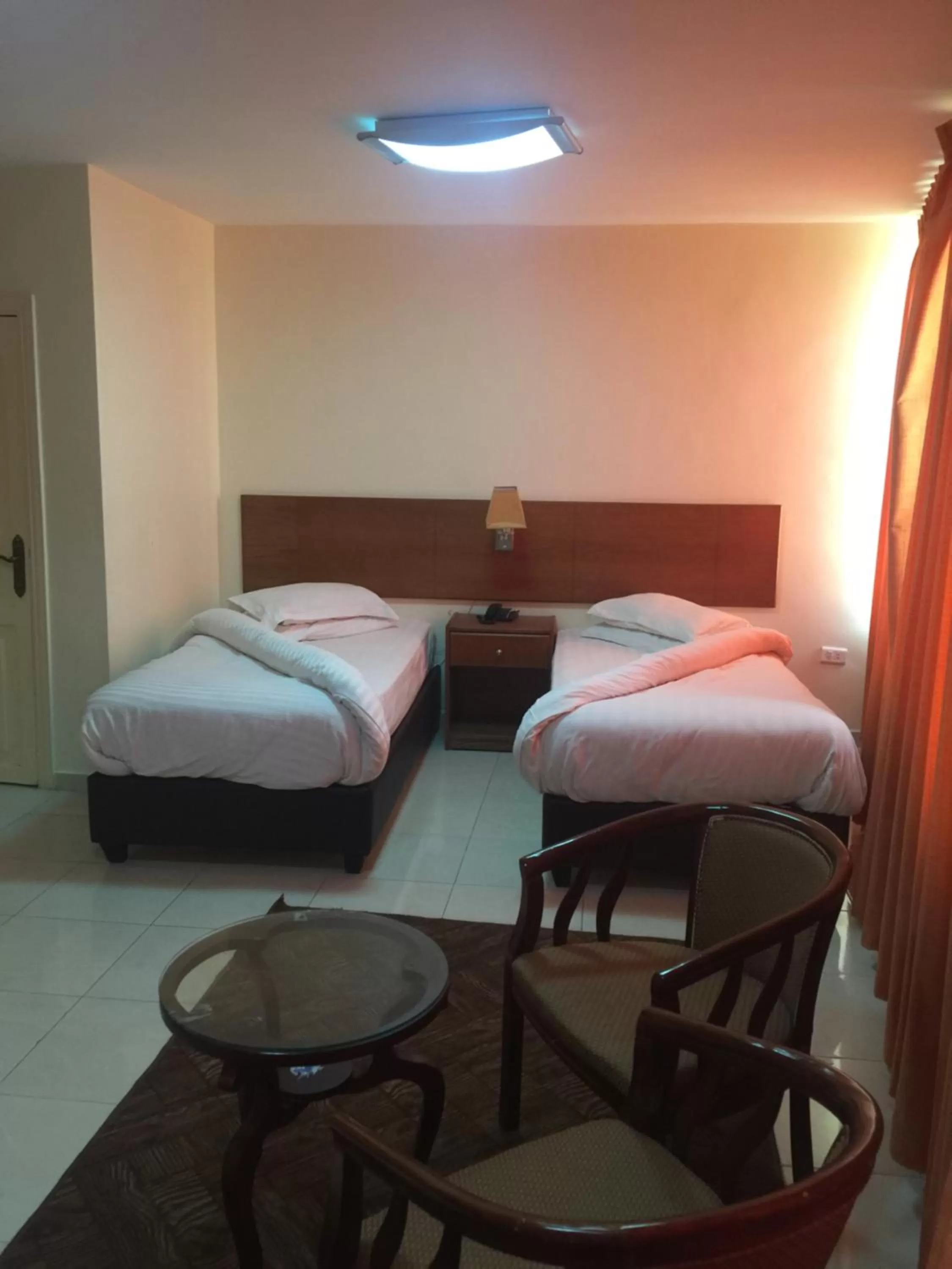 Bed in Zaina Plaza Hotel