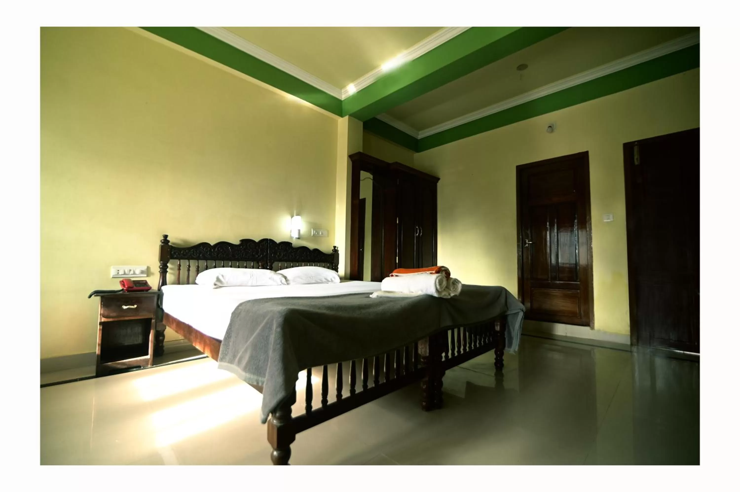 Bed in Sree Mookambika Beach Resort