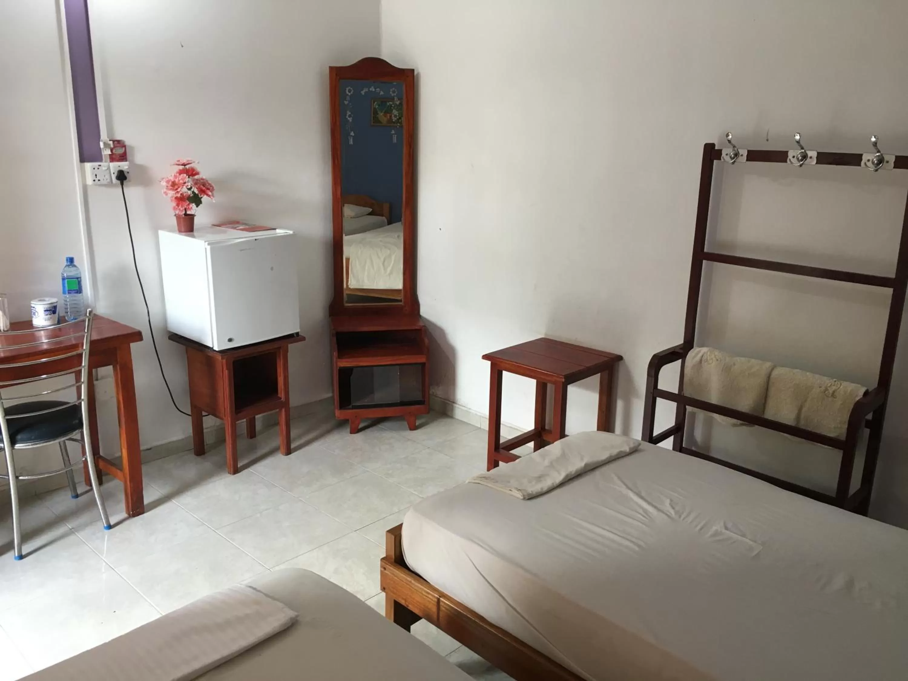 Photo of the whole room, Bed in Gnaanams Hotel and Restaurant