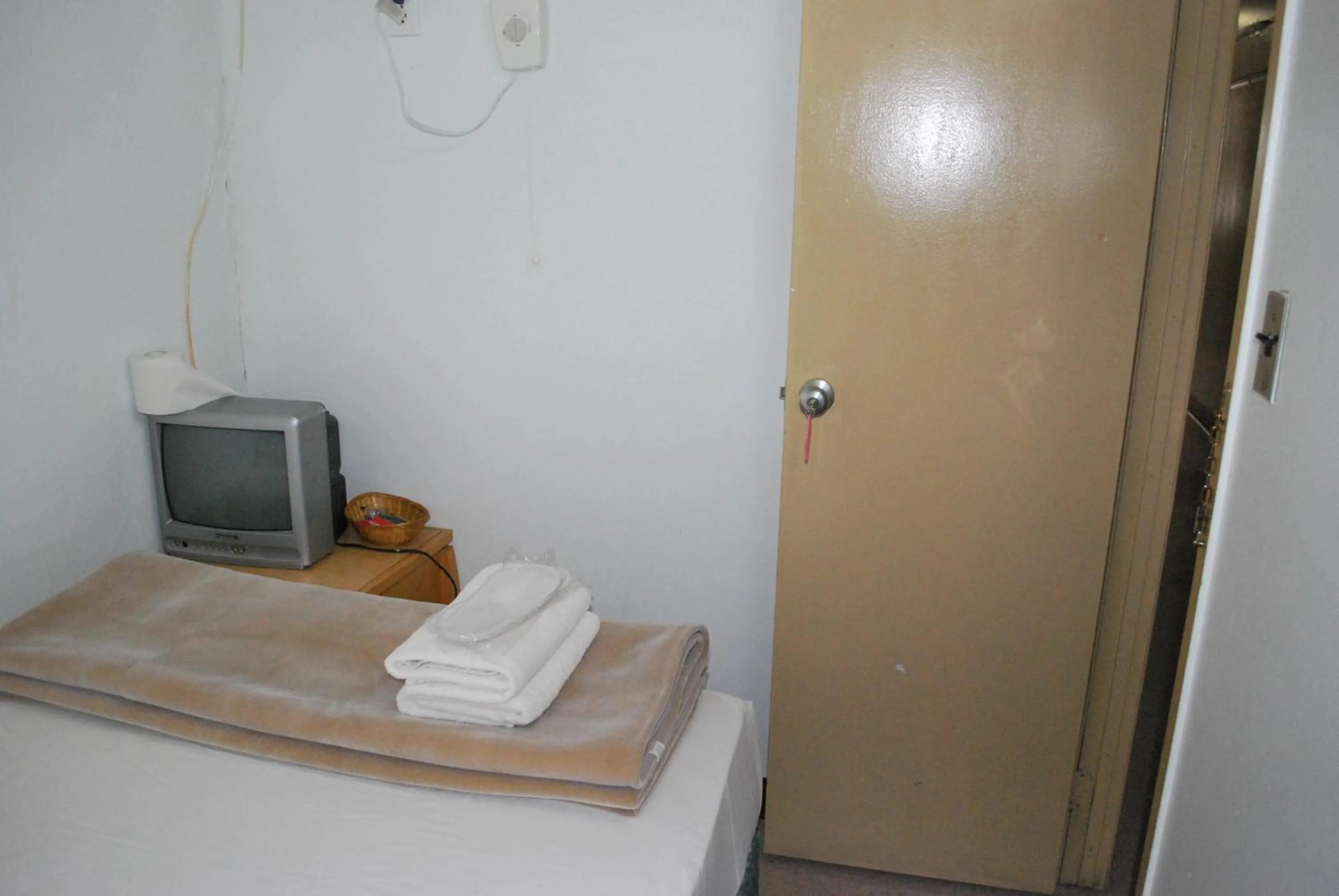 Bed in Bowery Grand Hotel