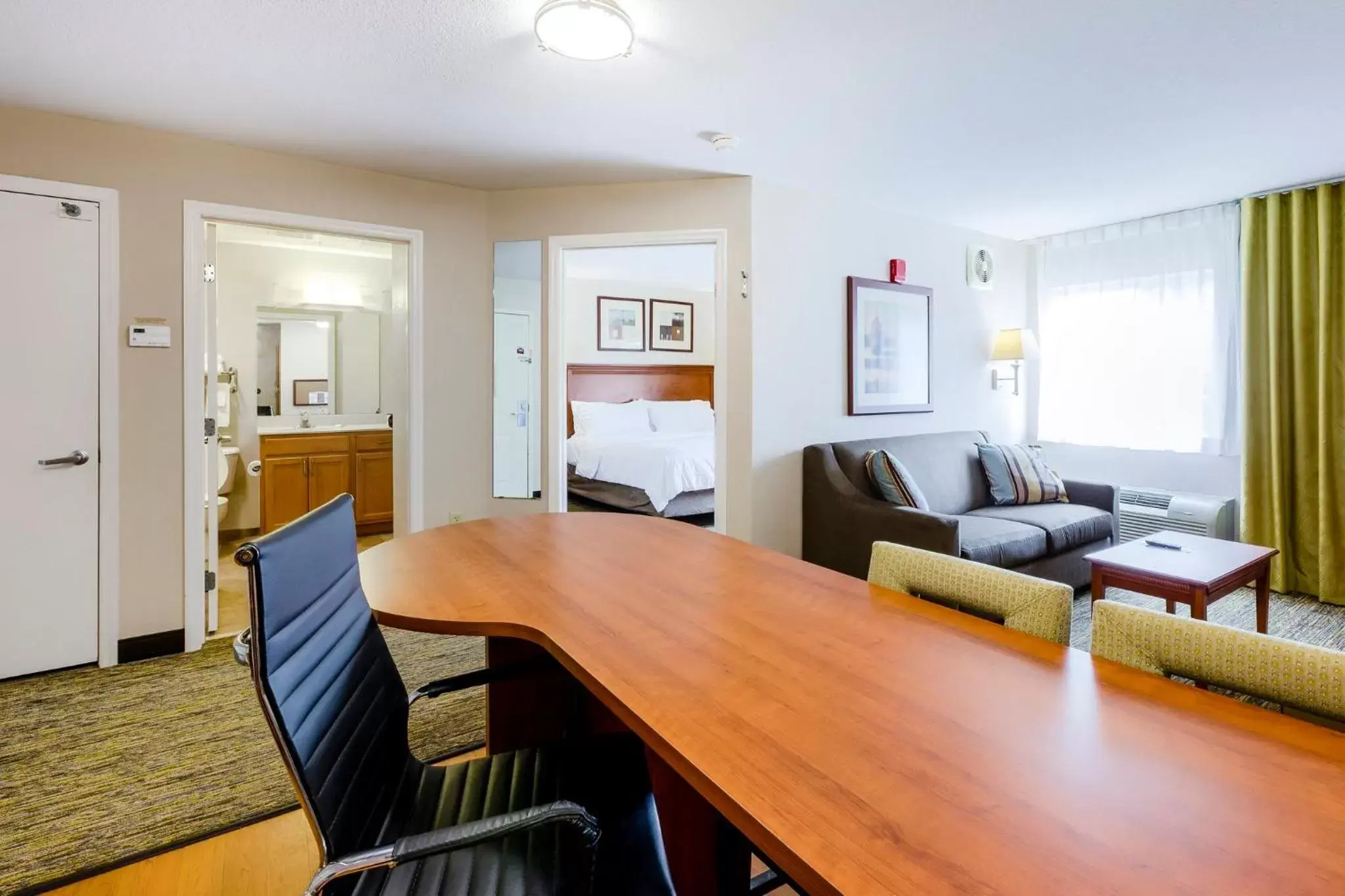 Bedroom, Dining Area in Candlewood Suites Savannah Airport, an IHG Hotel