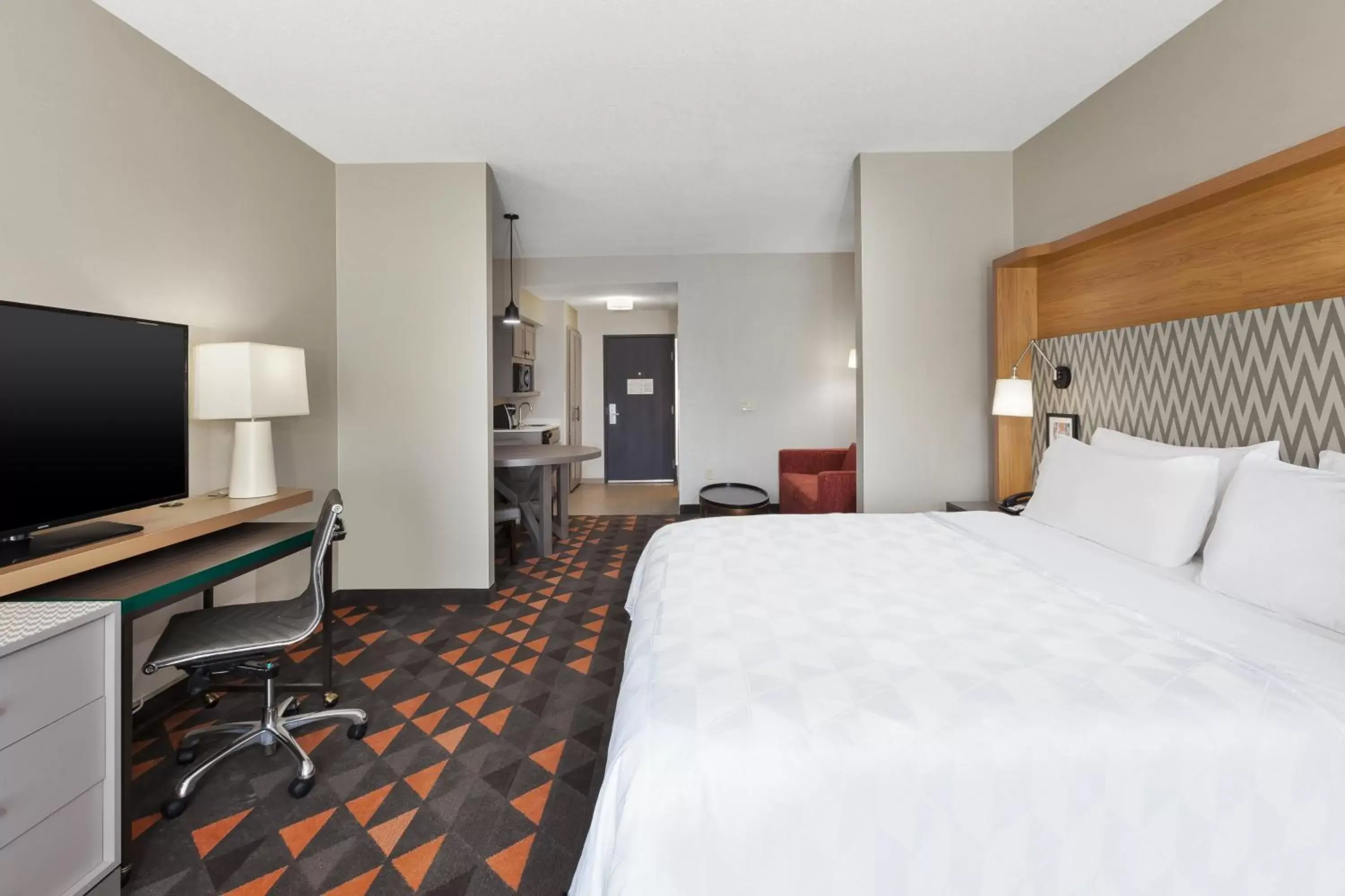 Photo of the whole room, TV/Entertainment Center in Holiday Inn Grand Rapids - South, an IHG Hotel