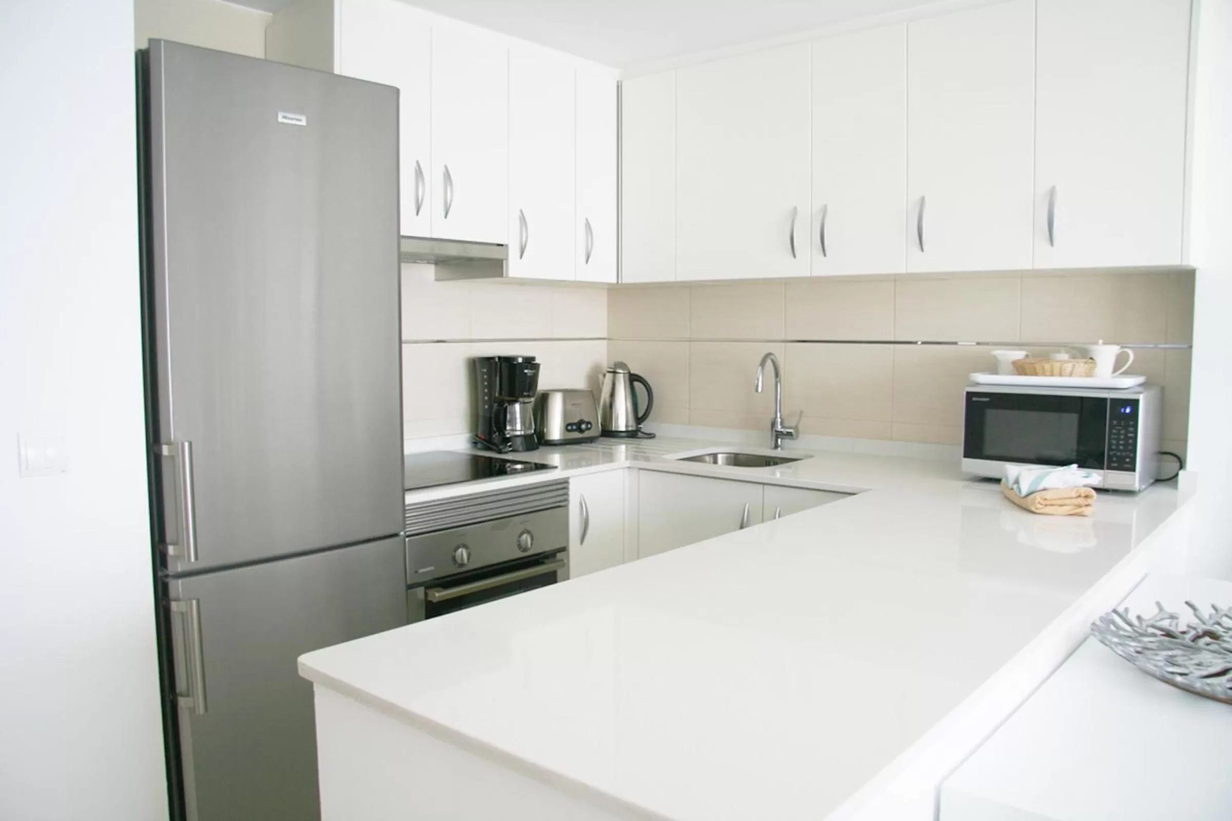 Kitchen or kitchenette in Camelina Suites