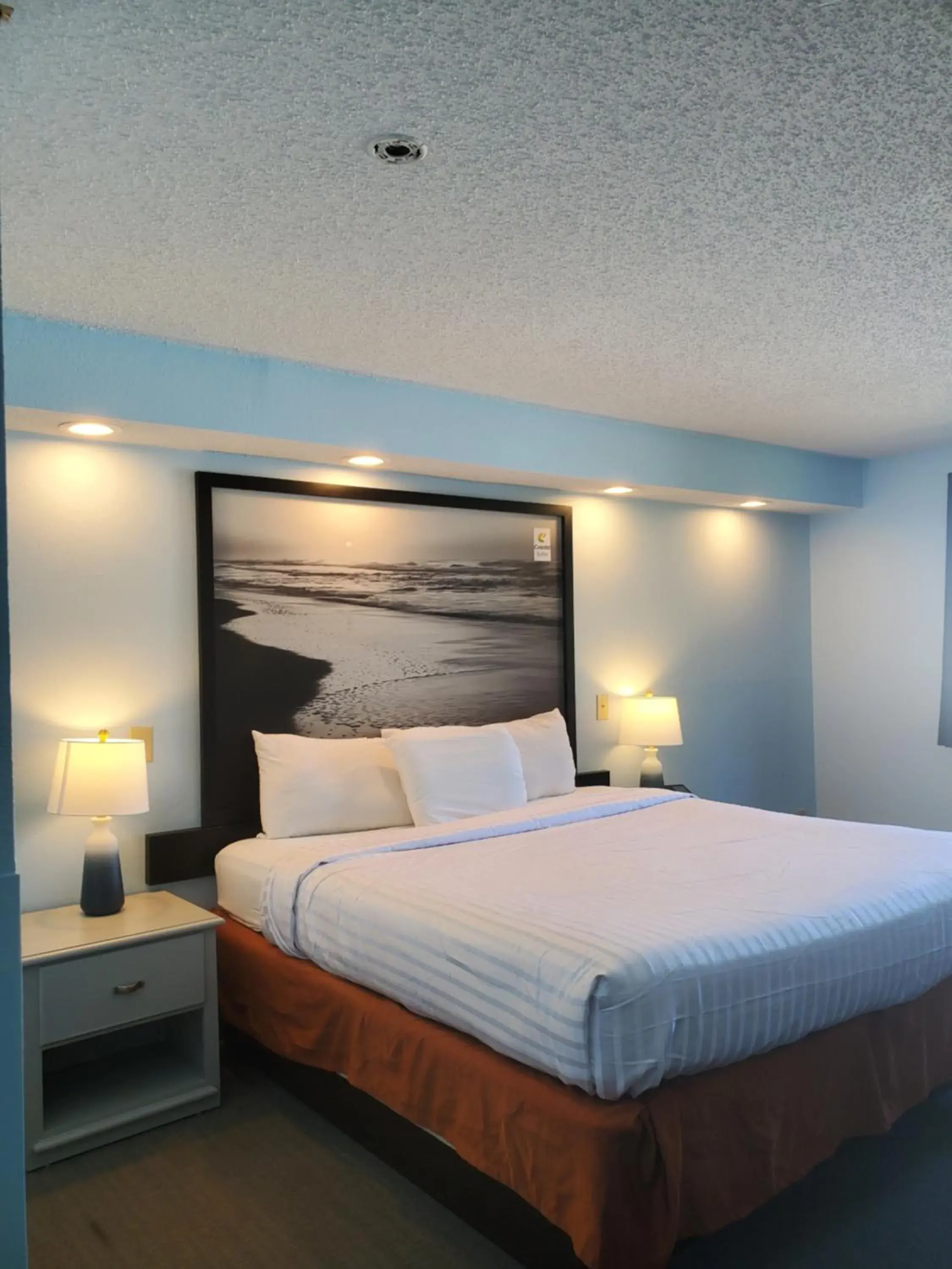 Bed in Coastal Inn & Suites