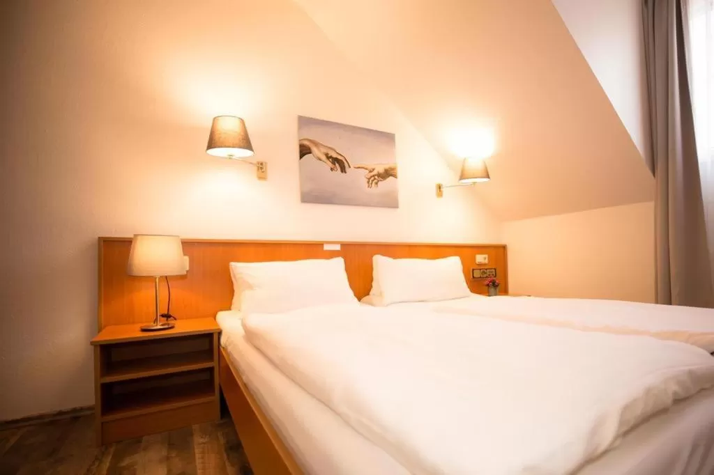 Bed in Hotel Weiße Mühle