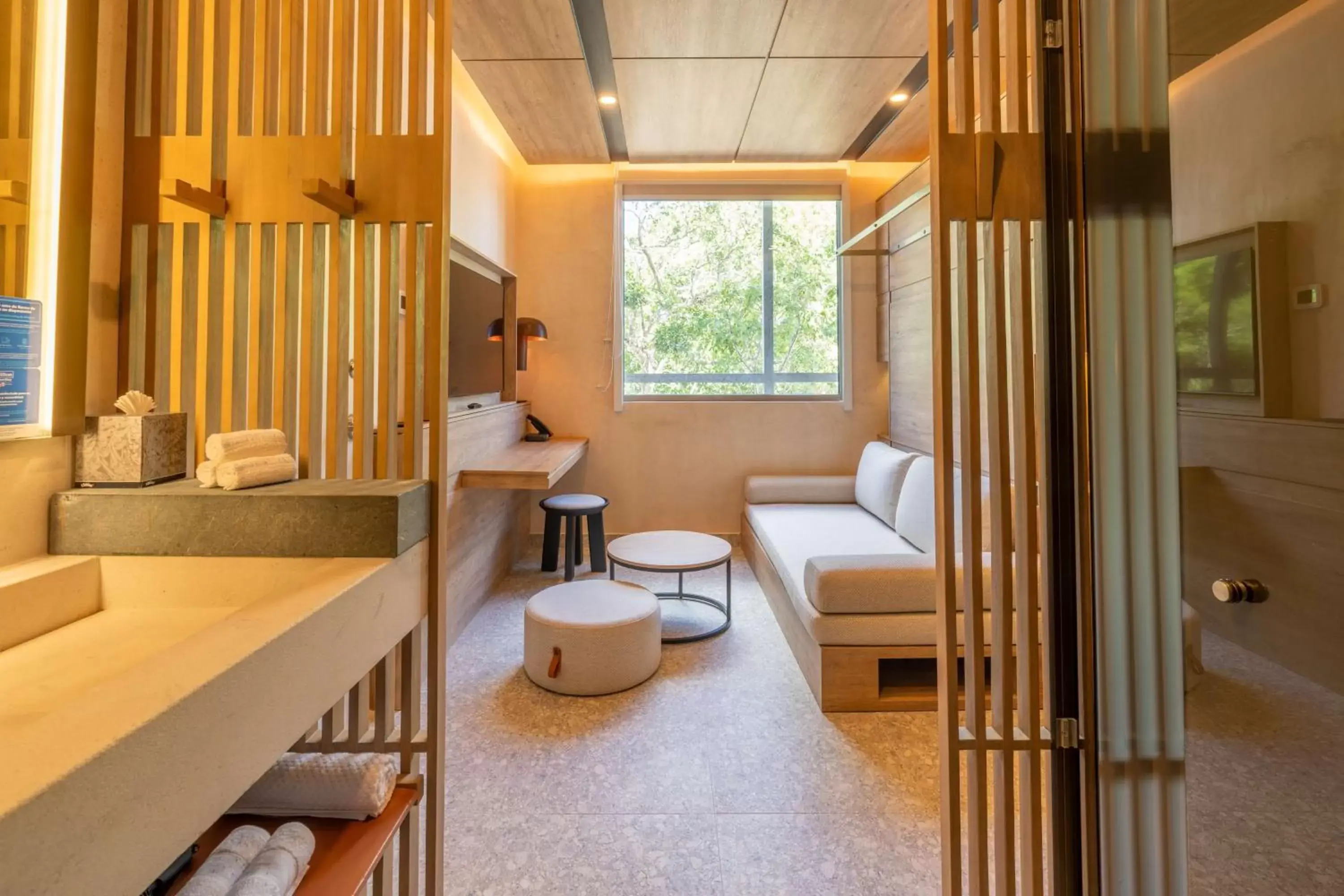 Living room, Bathroom in Motto By Hilton Tulum