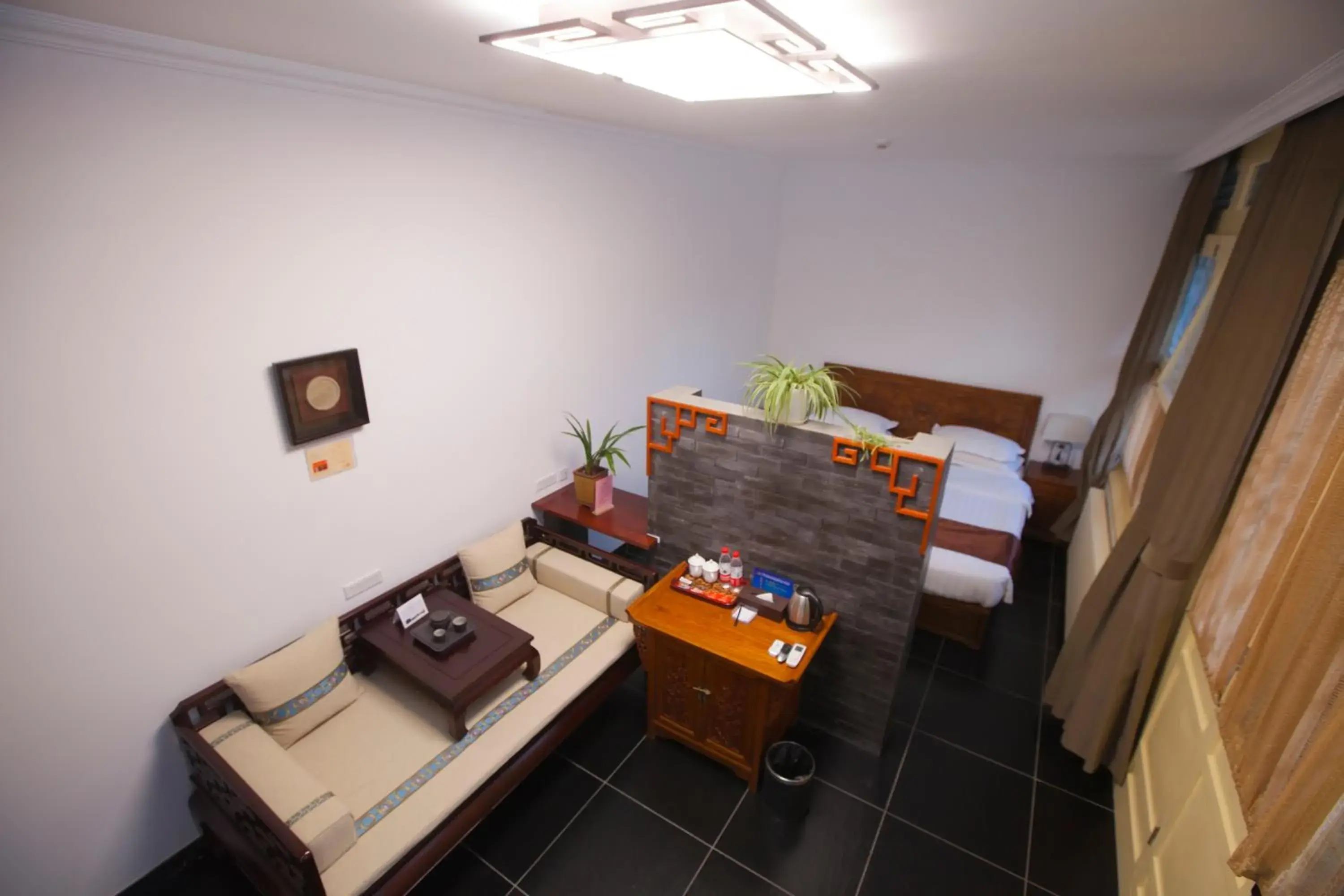 Family Room in Beijing Jingyuan Courtyard Hotel Family Room in Beijing Jingyuan Courtyard Hotel