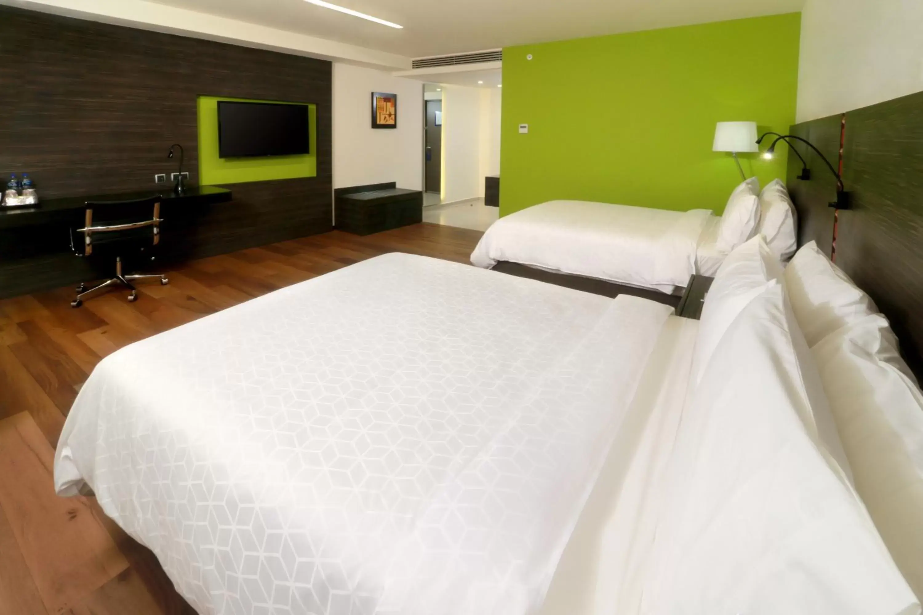 Bed in Holiday Inn Express Mexico Aeropuerto, an IHG Hotel