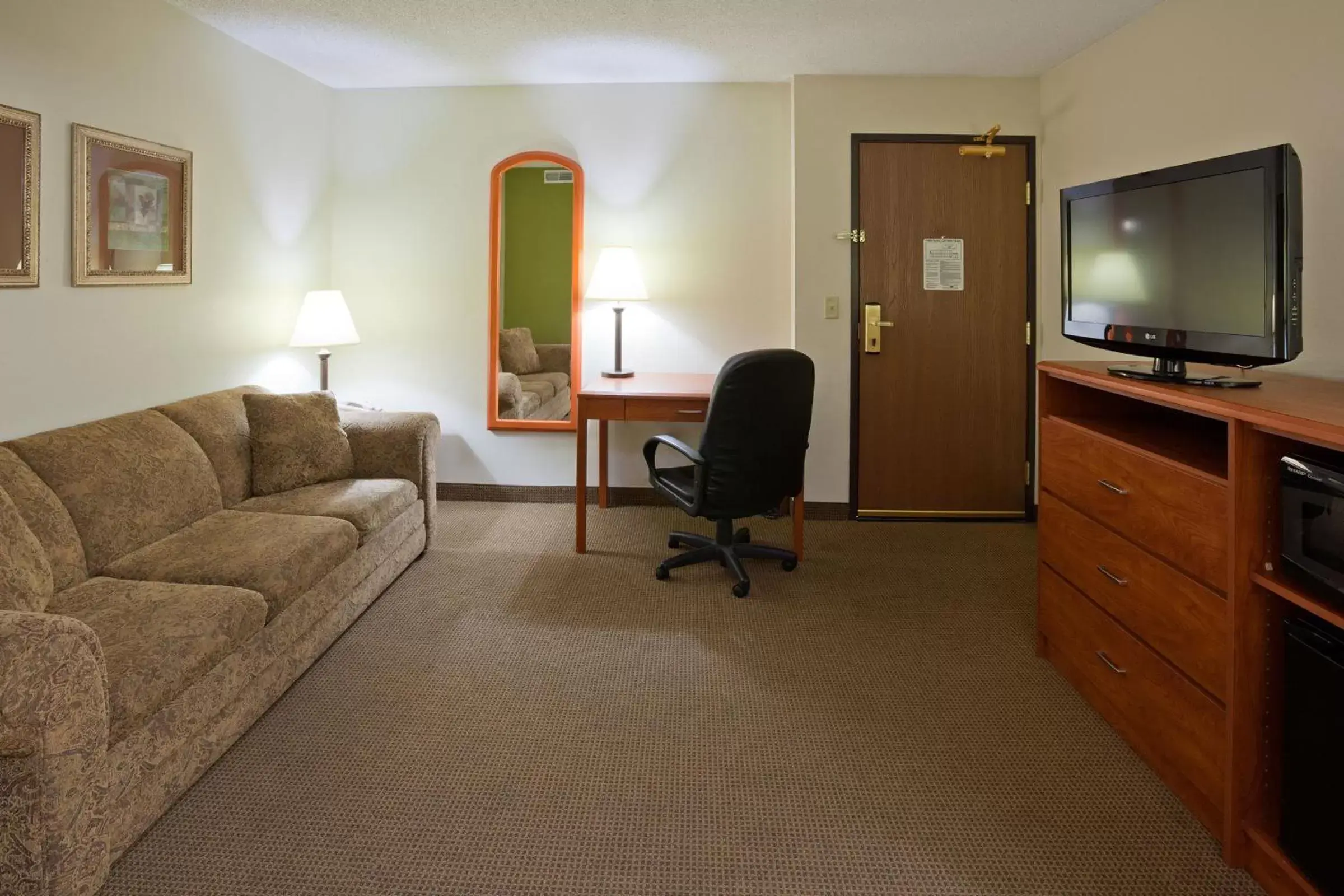 Bed, Seating Area in AmericInn by Wyndham Thief River Falls