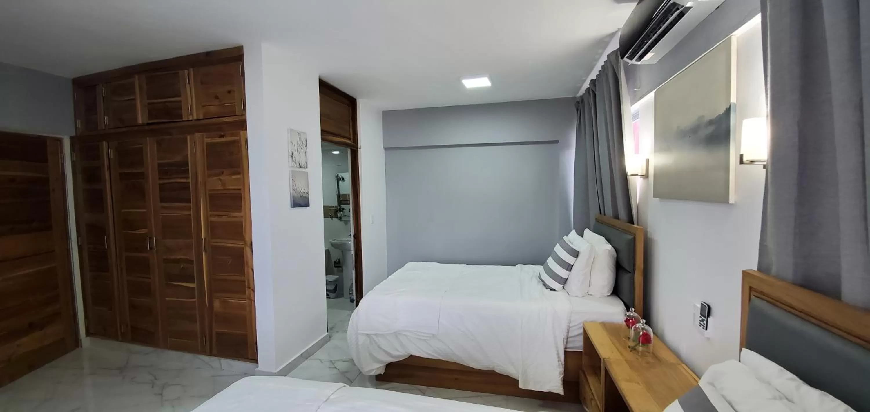 Bed in Boca Grande Hotel Suites