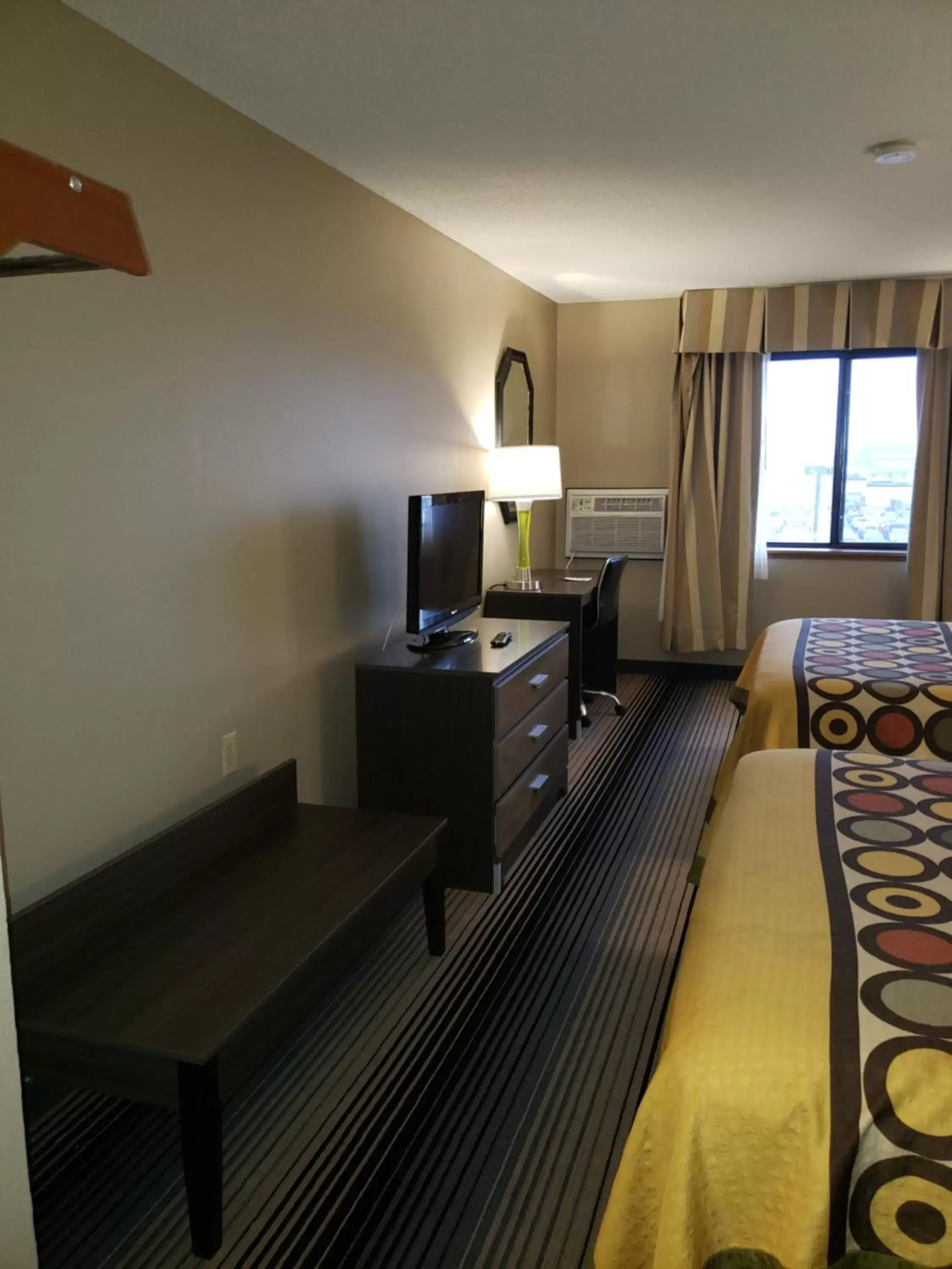 Photo of the whole room, TV/Entertainment Center in Super 8 by Wyndham Milwaukee Airport