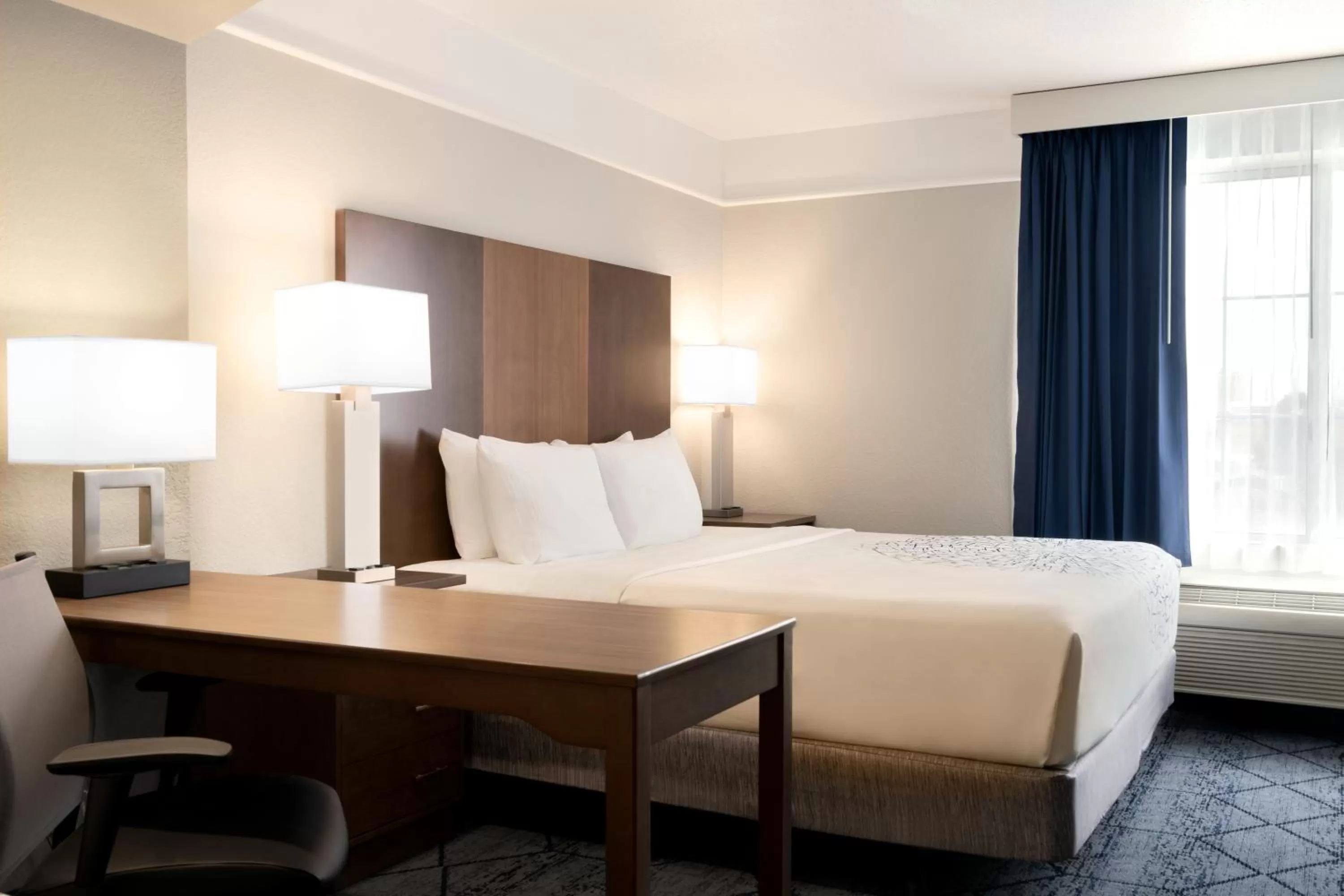 Bed in La Quinta Inn and Suites by Wyndham at WaTiki Waterpark