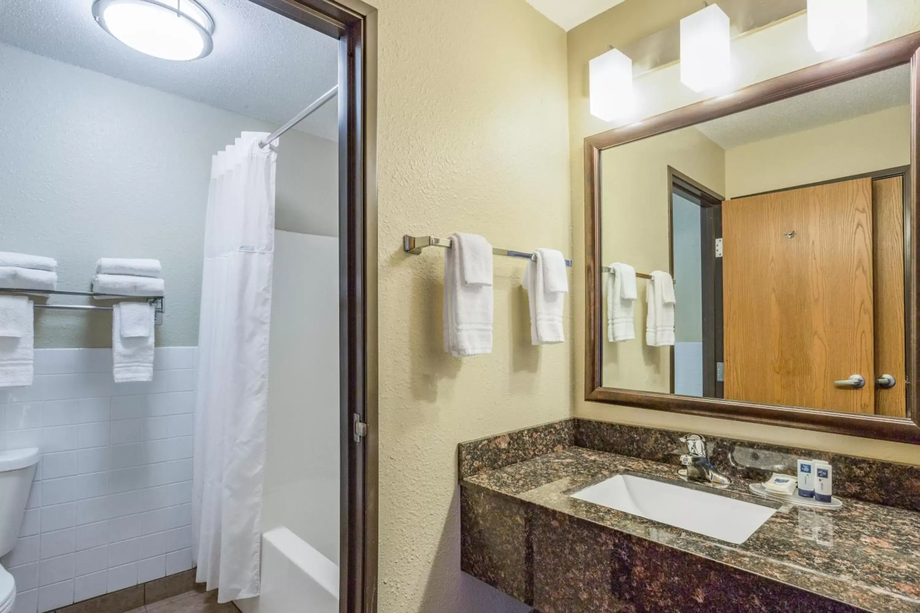 Bathroom in AmericInn by Wyndham Menomonie