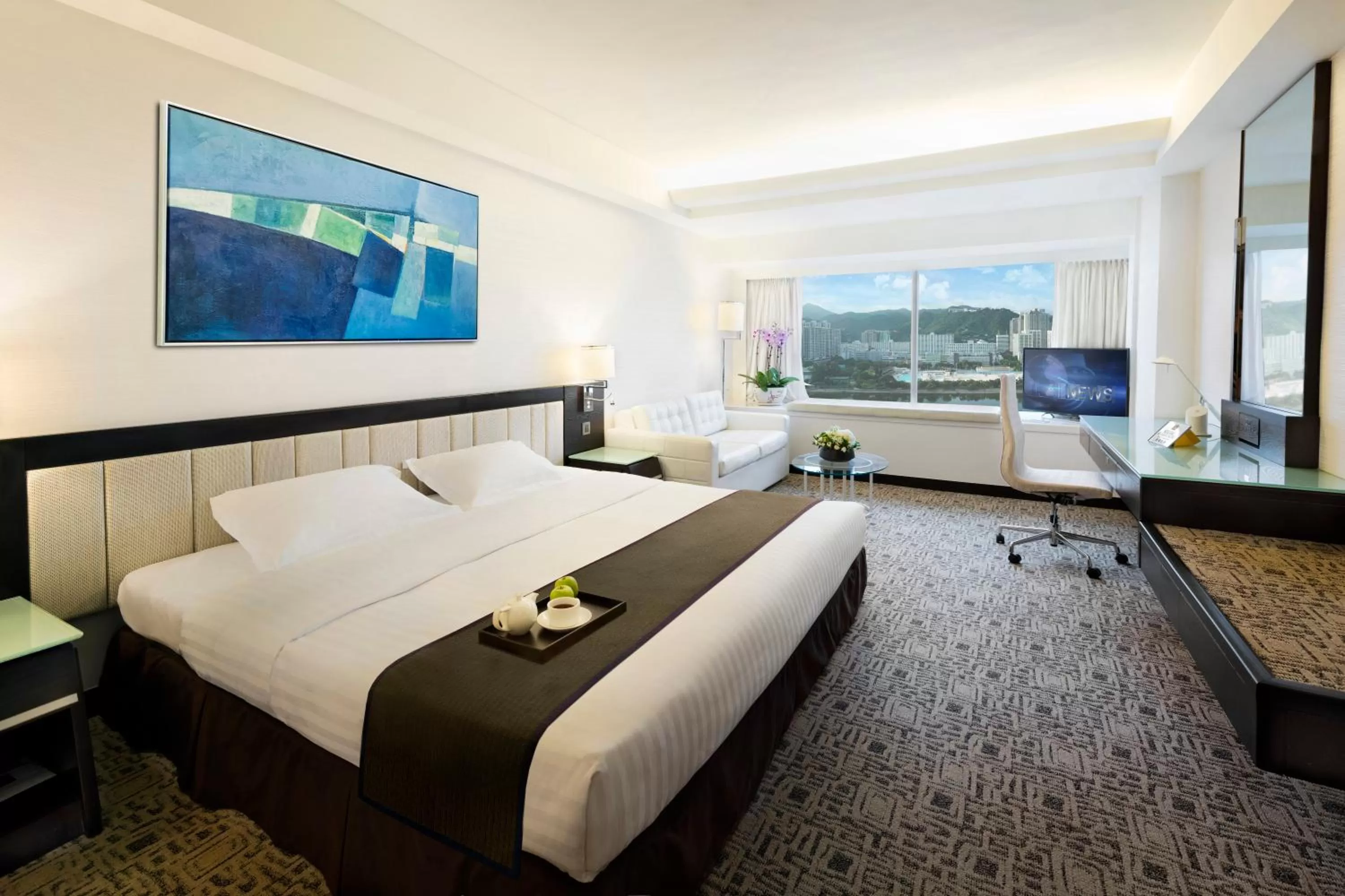 Bed in Regal Riverside Hotel