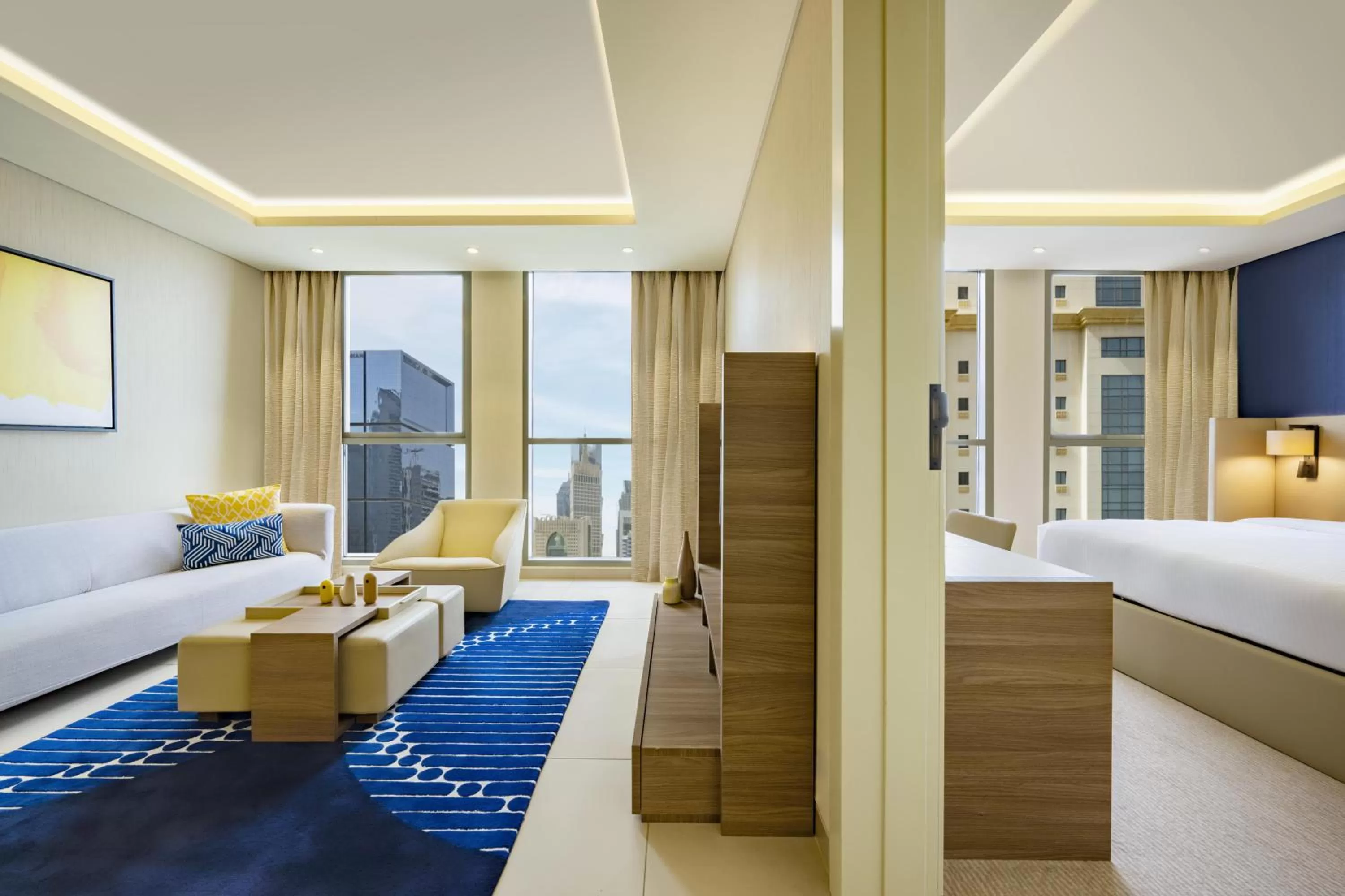 Living room, Bed in voco Doha West Bay Suites by IHG