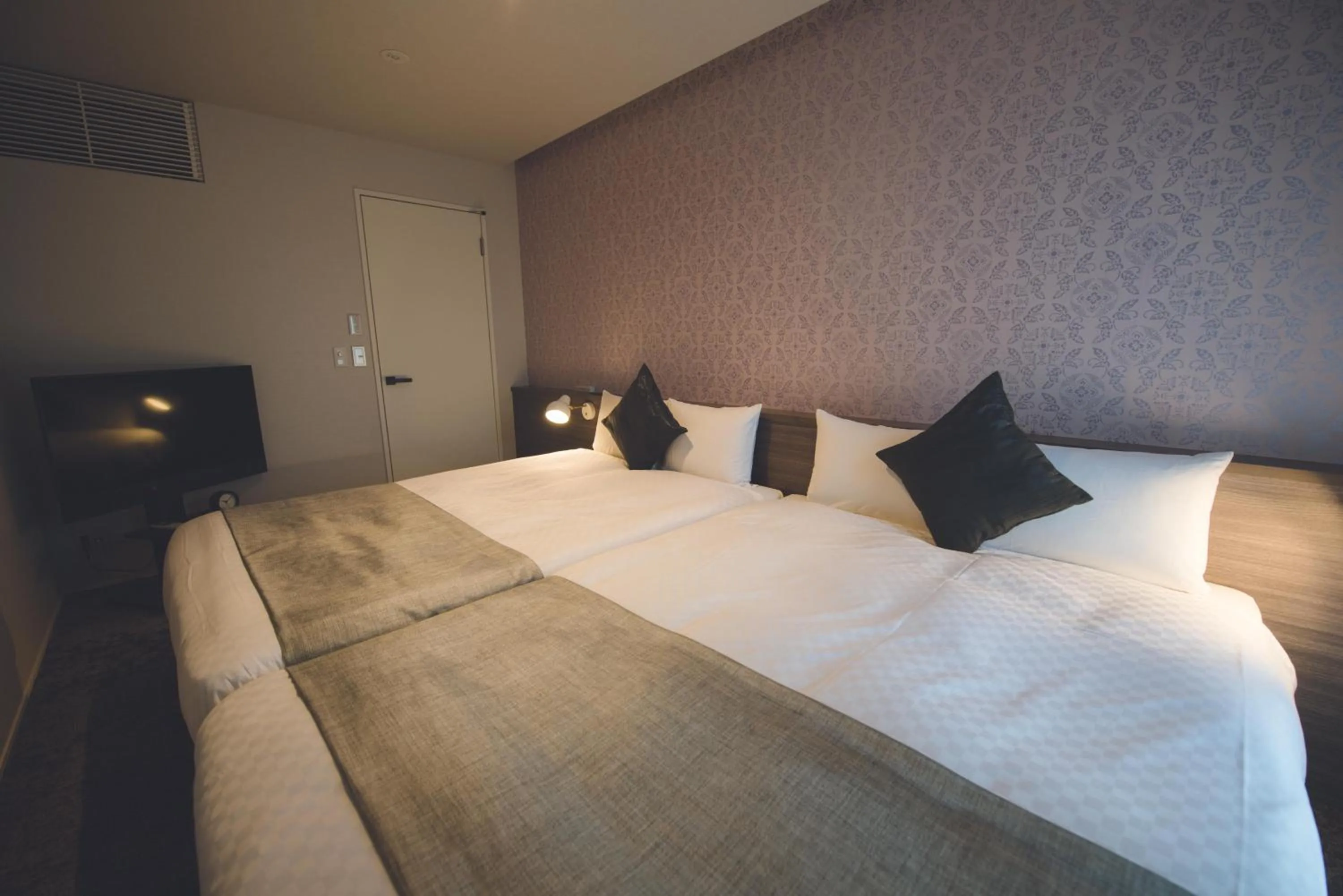 Bed in HOTEL MASTAY jingumichi