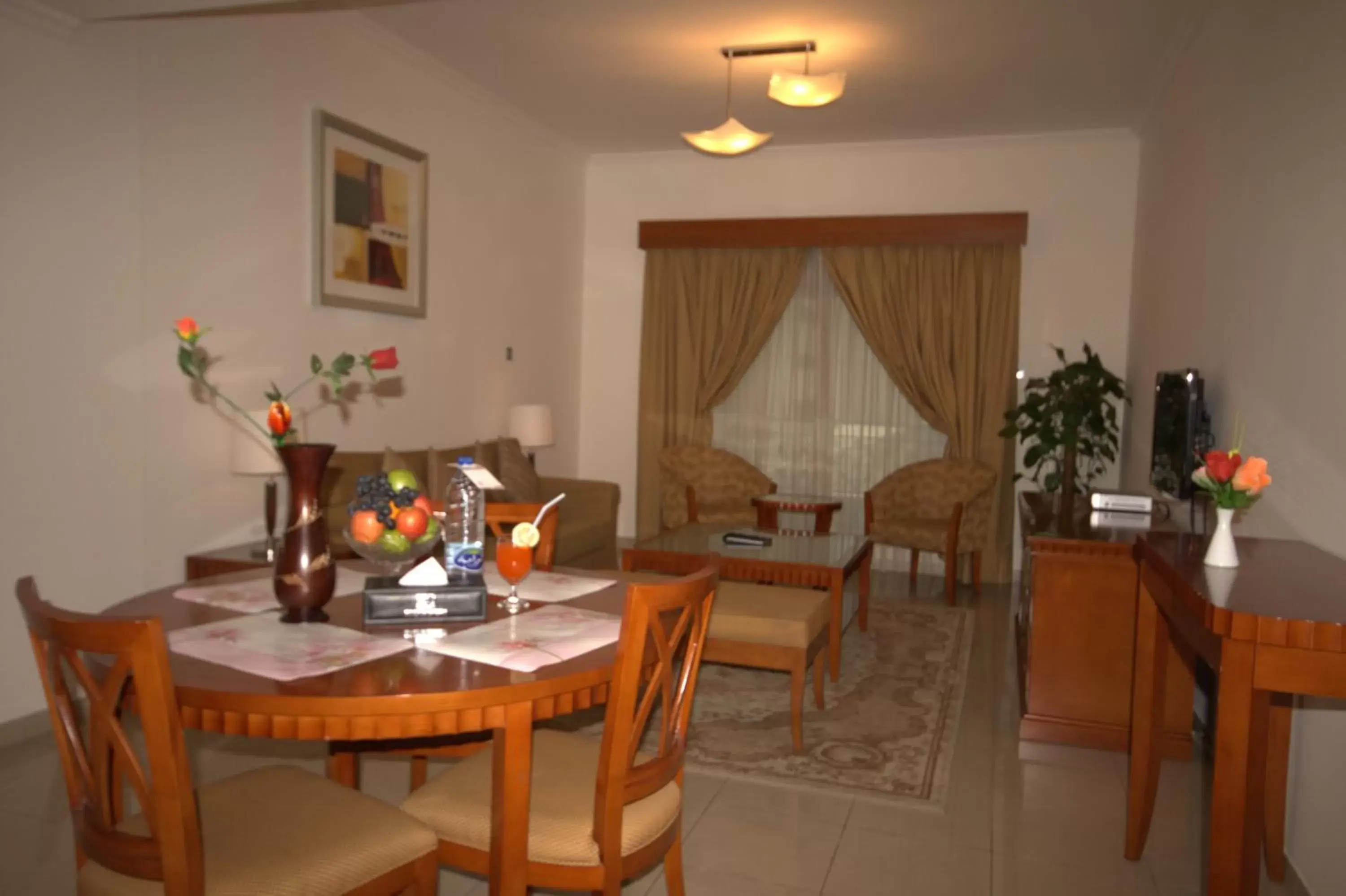 Living room, Restaurant/Places to Eat in Rose Garden Hotel Apartments - Bur Dubai
