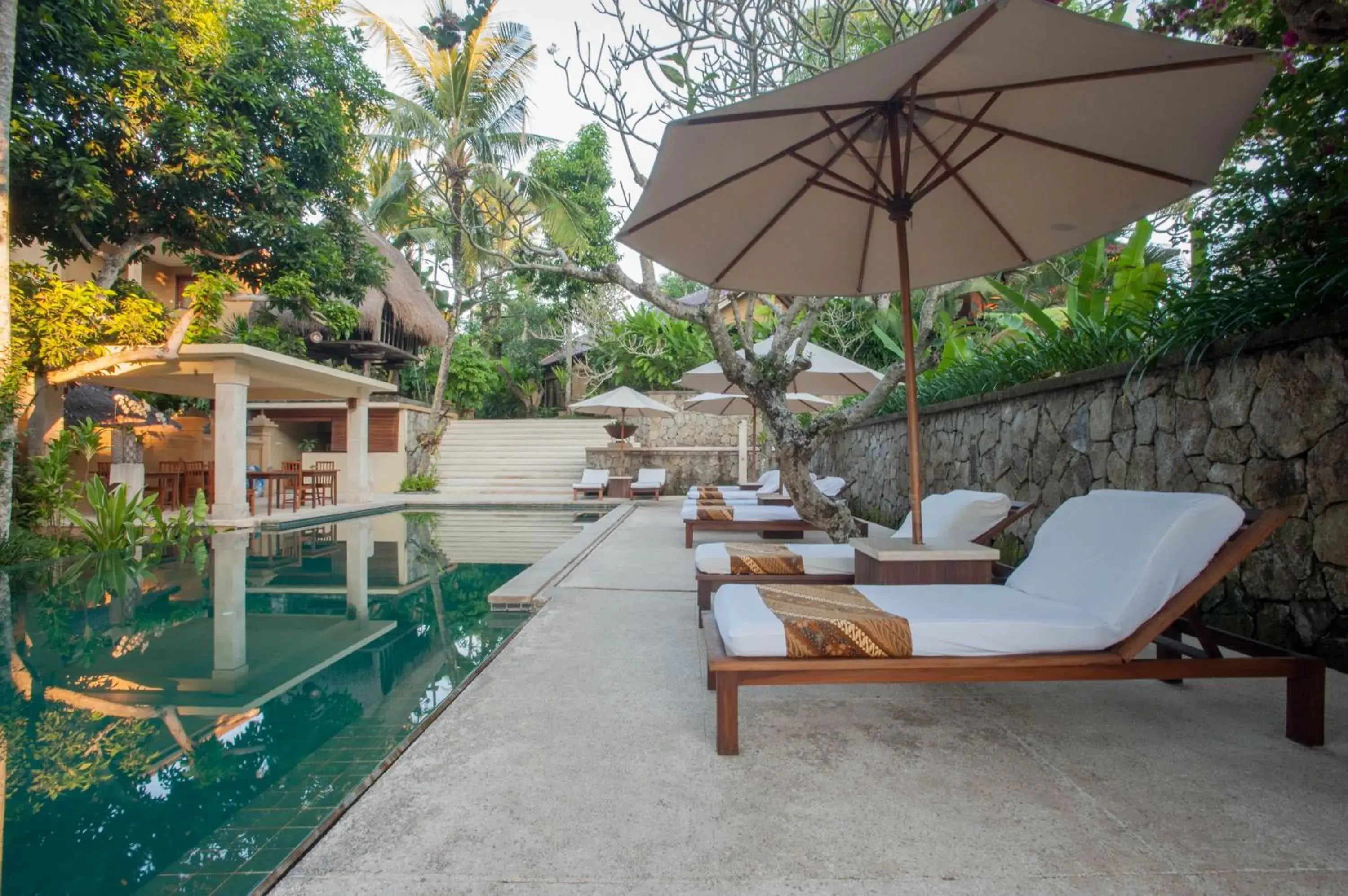 Seating area, Swimming Pool in Komaneka at Monkey Forest Ubud