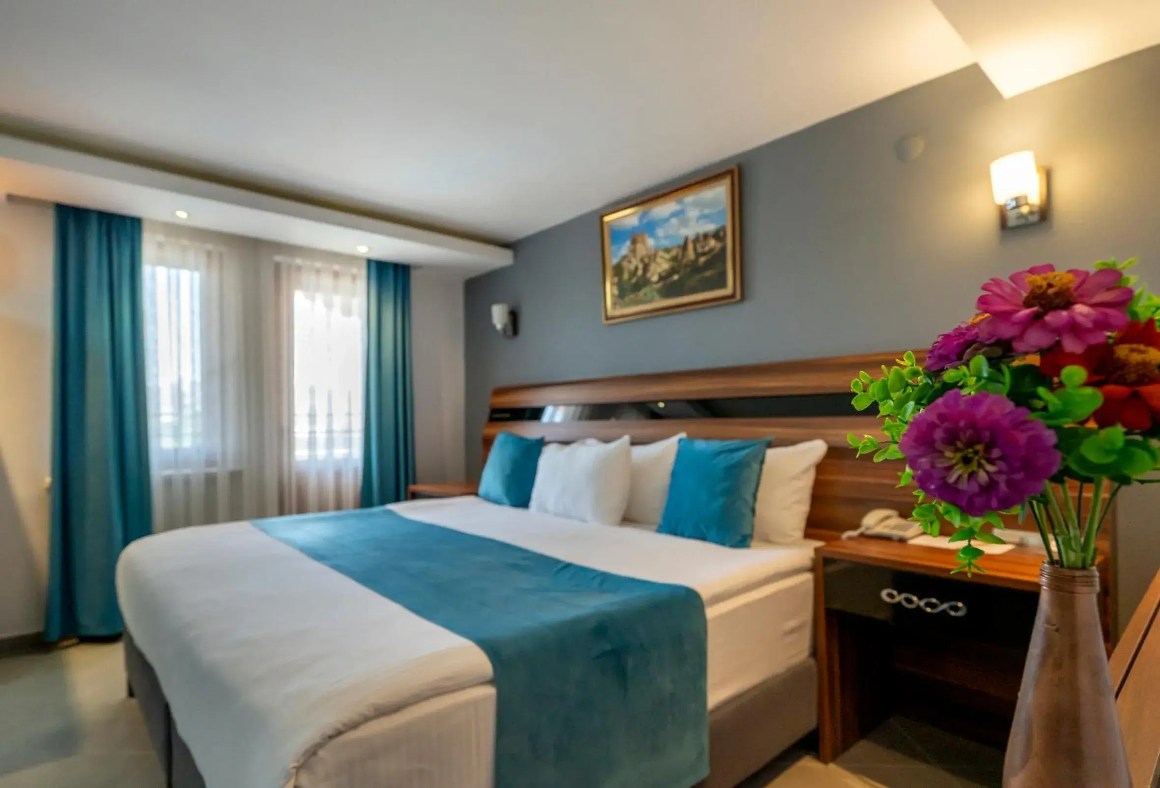 Bed in SIGNATURE GARDEN AVANOS Hotel & SPA