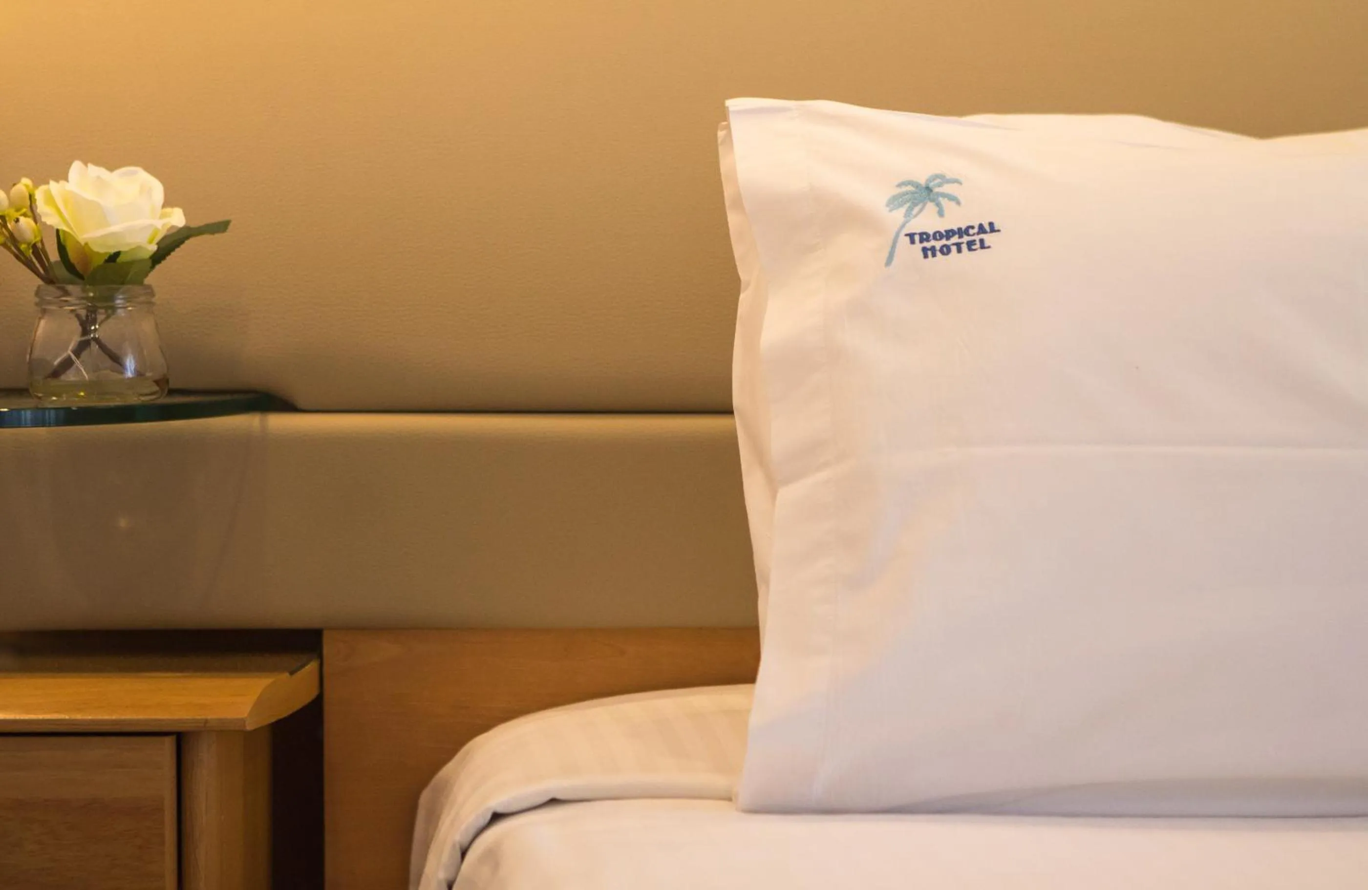 Property logo or sign, Bed in Tropical Hotel