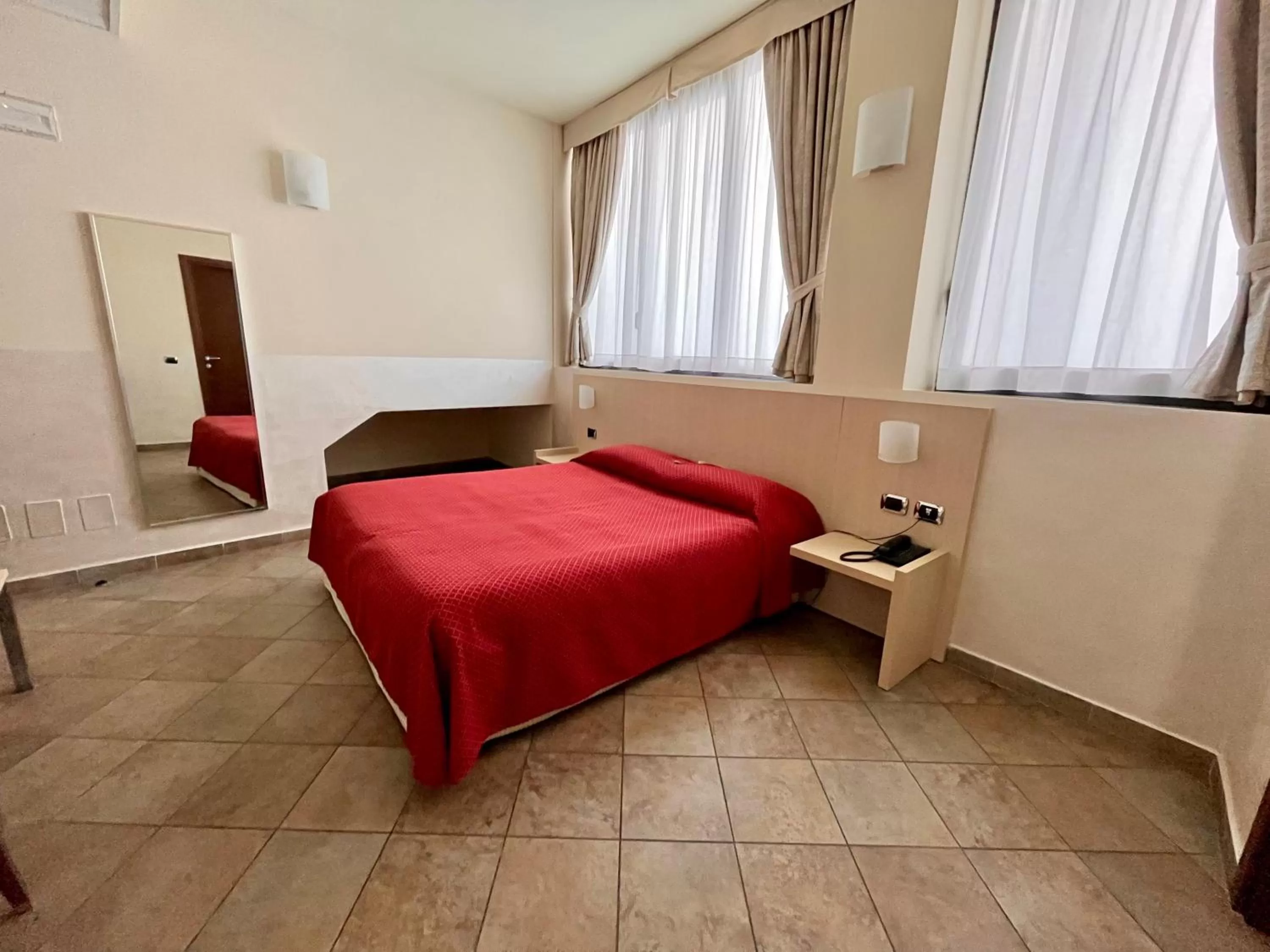 Bed in Hotel Lovere Resort & Spa