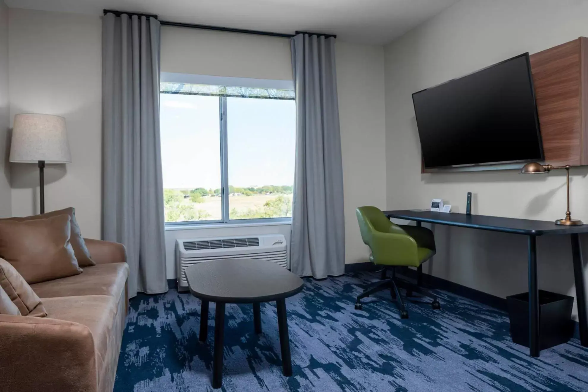 TV/Entertainment Center in Fairfield by Marriott Inn & Suites Dallas DFW Airport North, Irving
