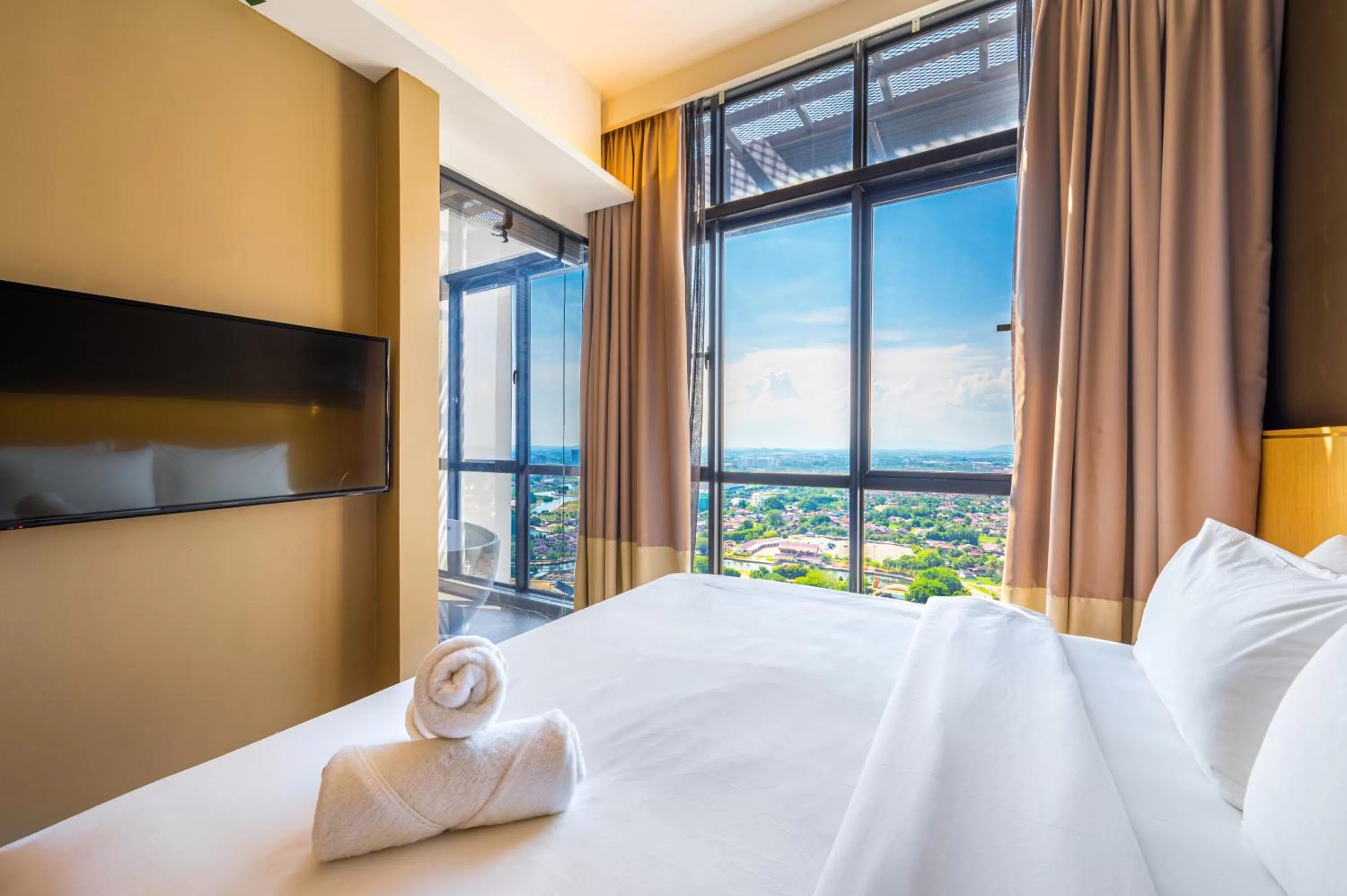 Bed in Greystone 99 Suites