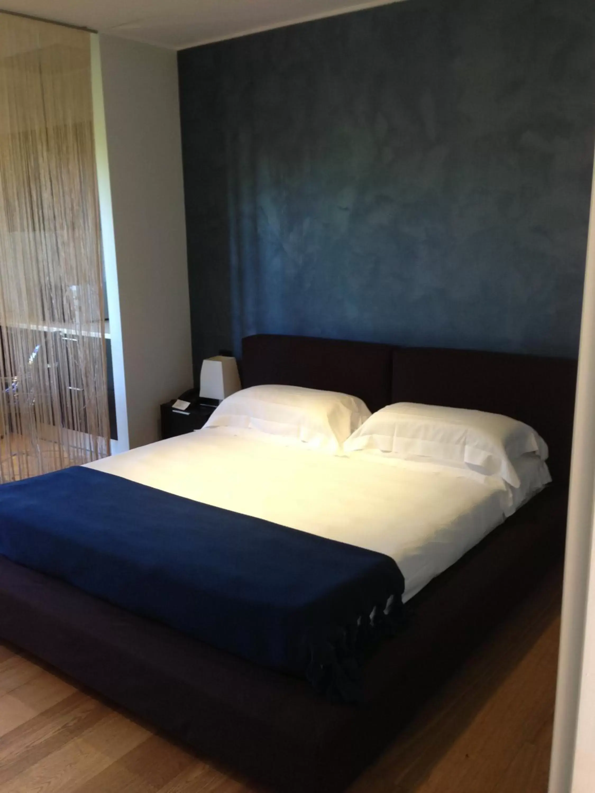 Bed in Joia Hotel & Luxury Apartments