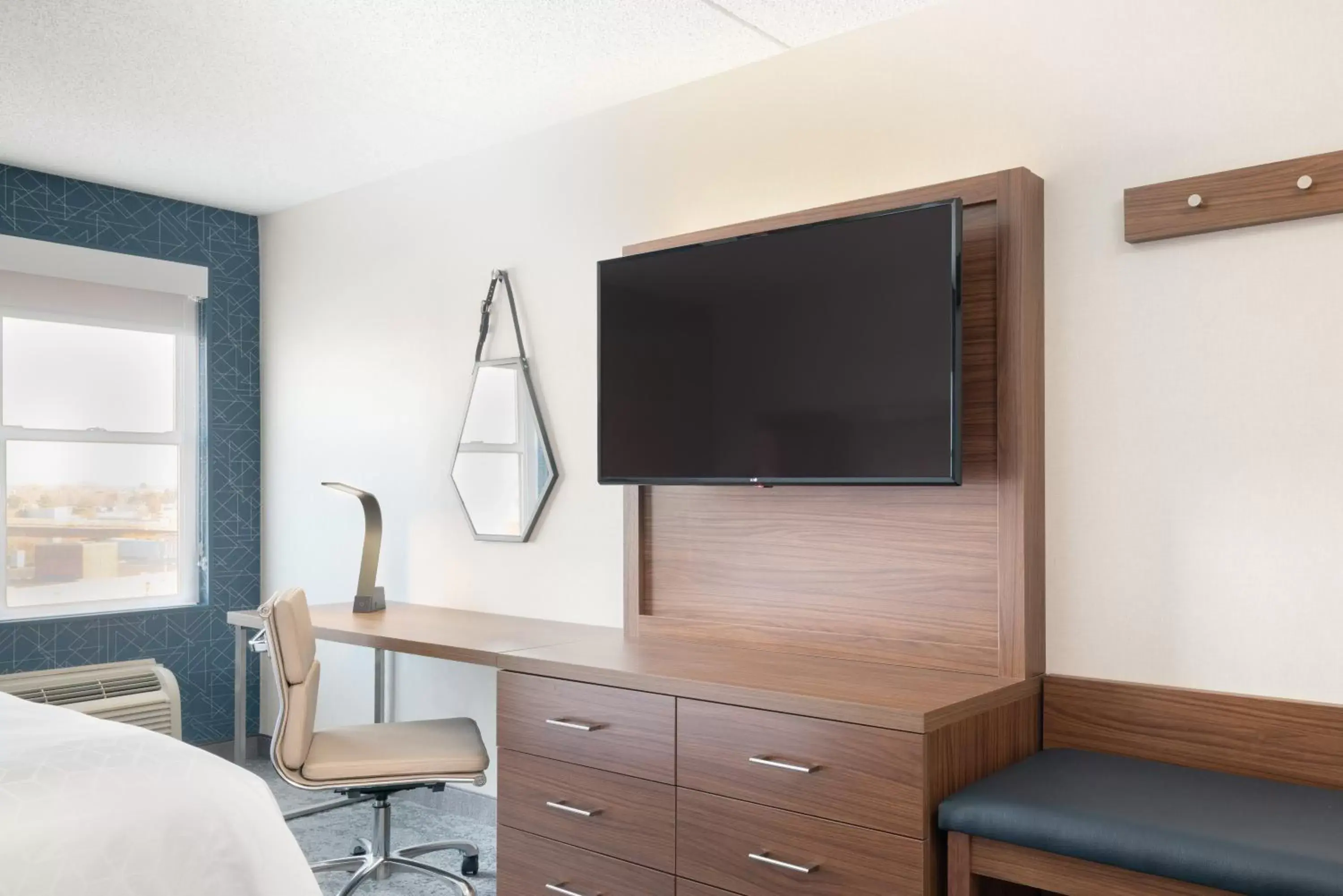 Photo of the whole room, TV/Entertainment Center in Holiday Inn Express & Suites Boston - Cambridge, an IHG Hotel