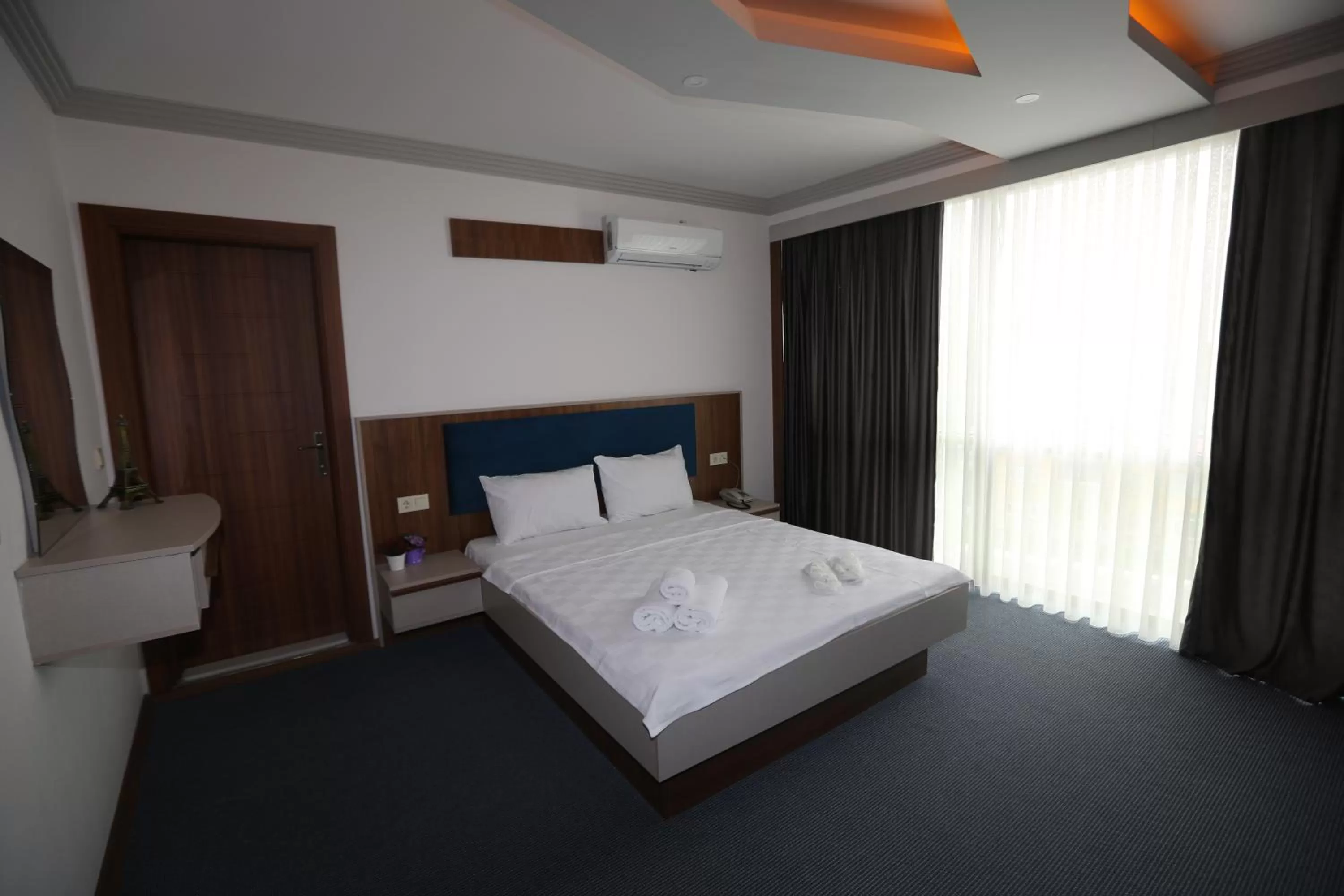 Bed in TEVETOGLU HOTEL