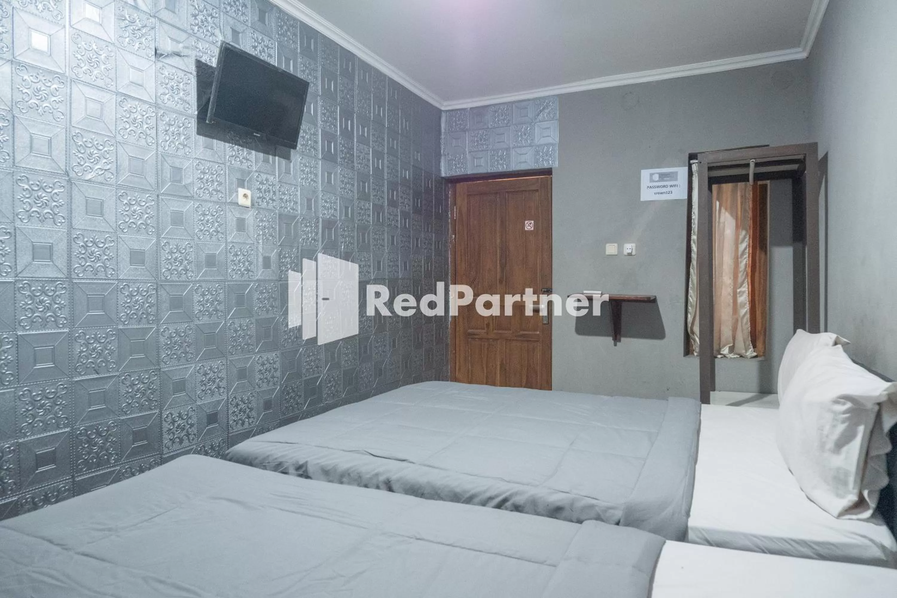 Bedroom in Crown Residence near Tugu Yogyakarta RedPartner