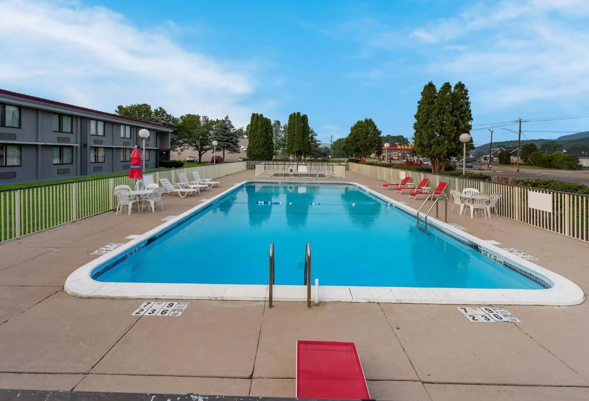 Swimming pool in HomeTowne Studios by Red Roof Painted Post