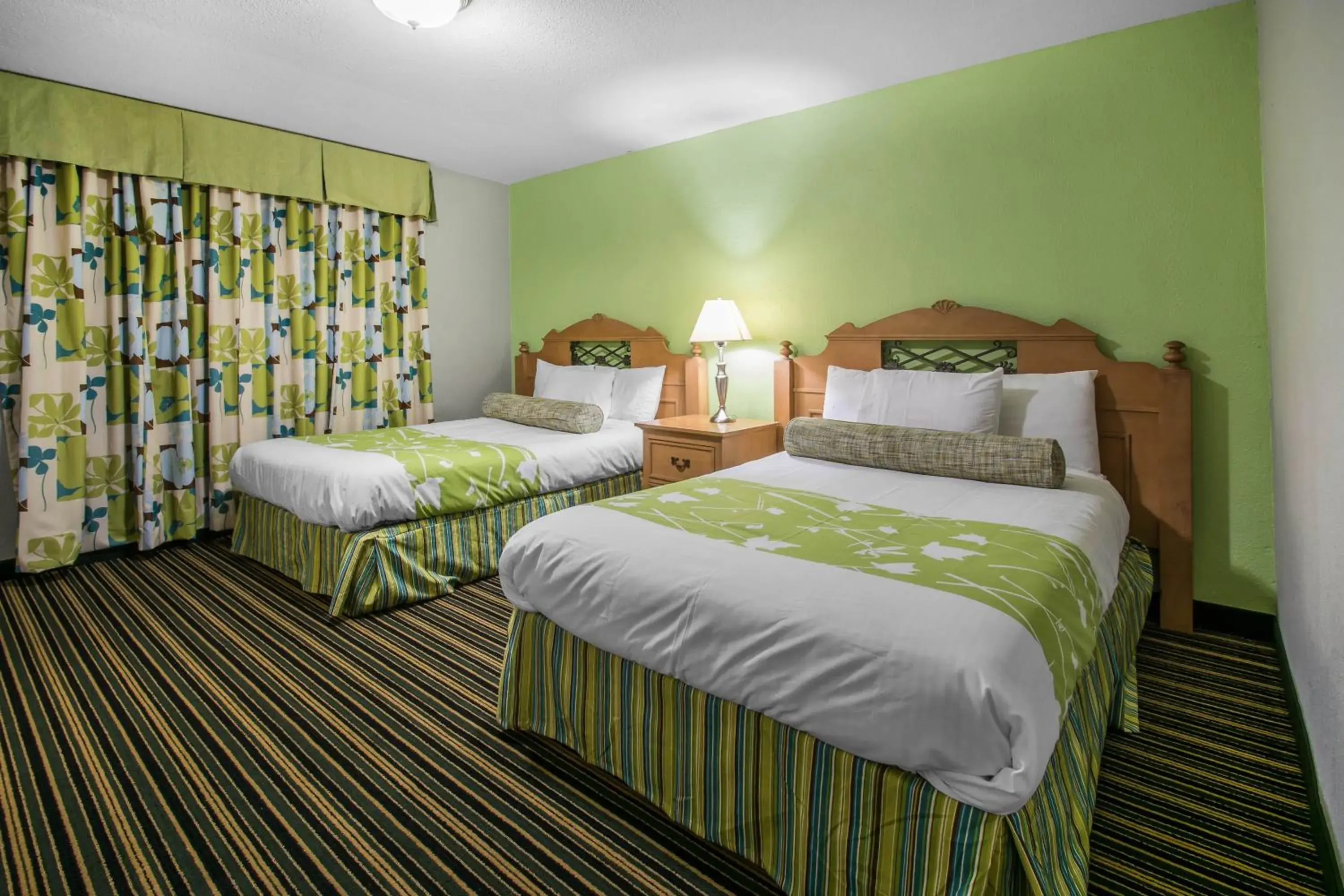 Bedroom, Bed in Rodeway Inn & Suites Winter Haven Chain of Lakes