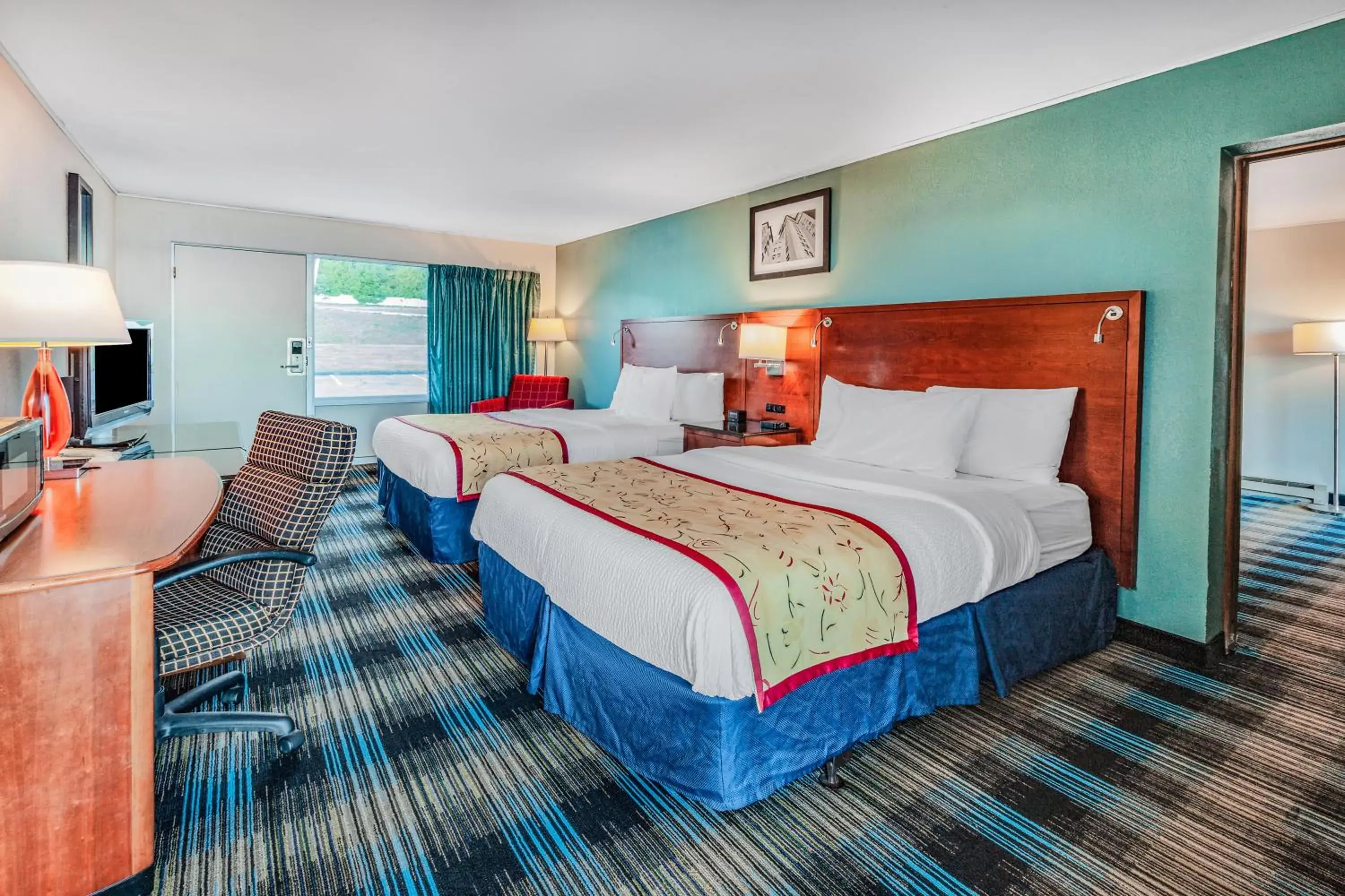 Bed in Days Inn & Suites by Wyndham St. Ignace Lakefront