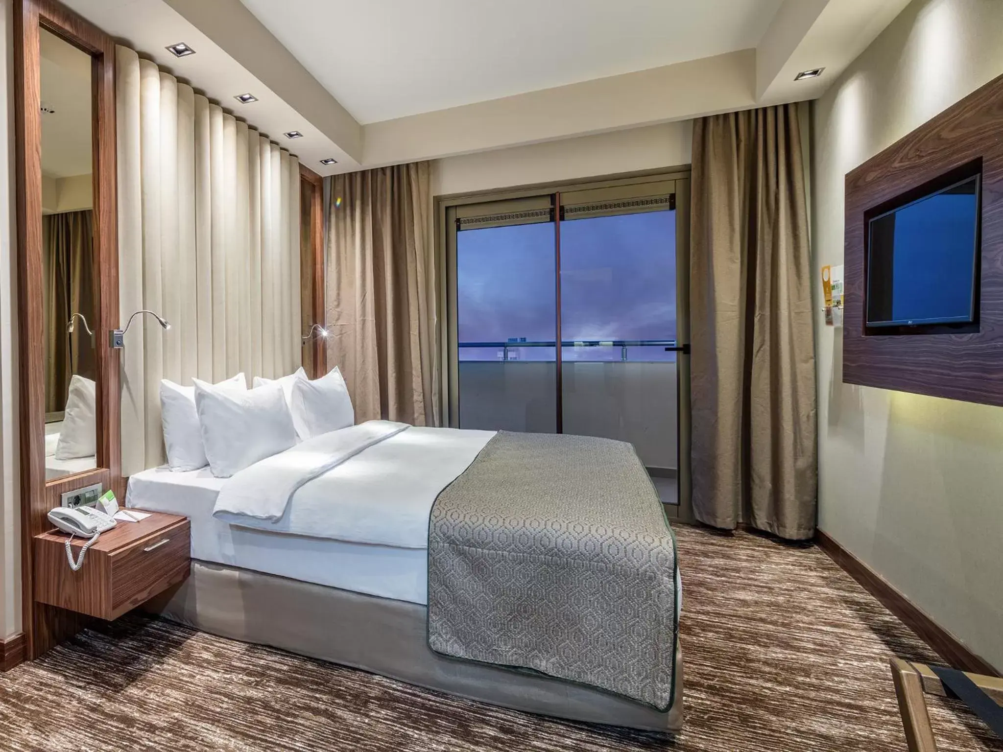 Bed in Holiday Inn Antalya - Lara, an IHG Hotel