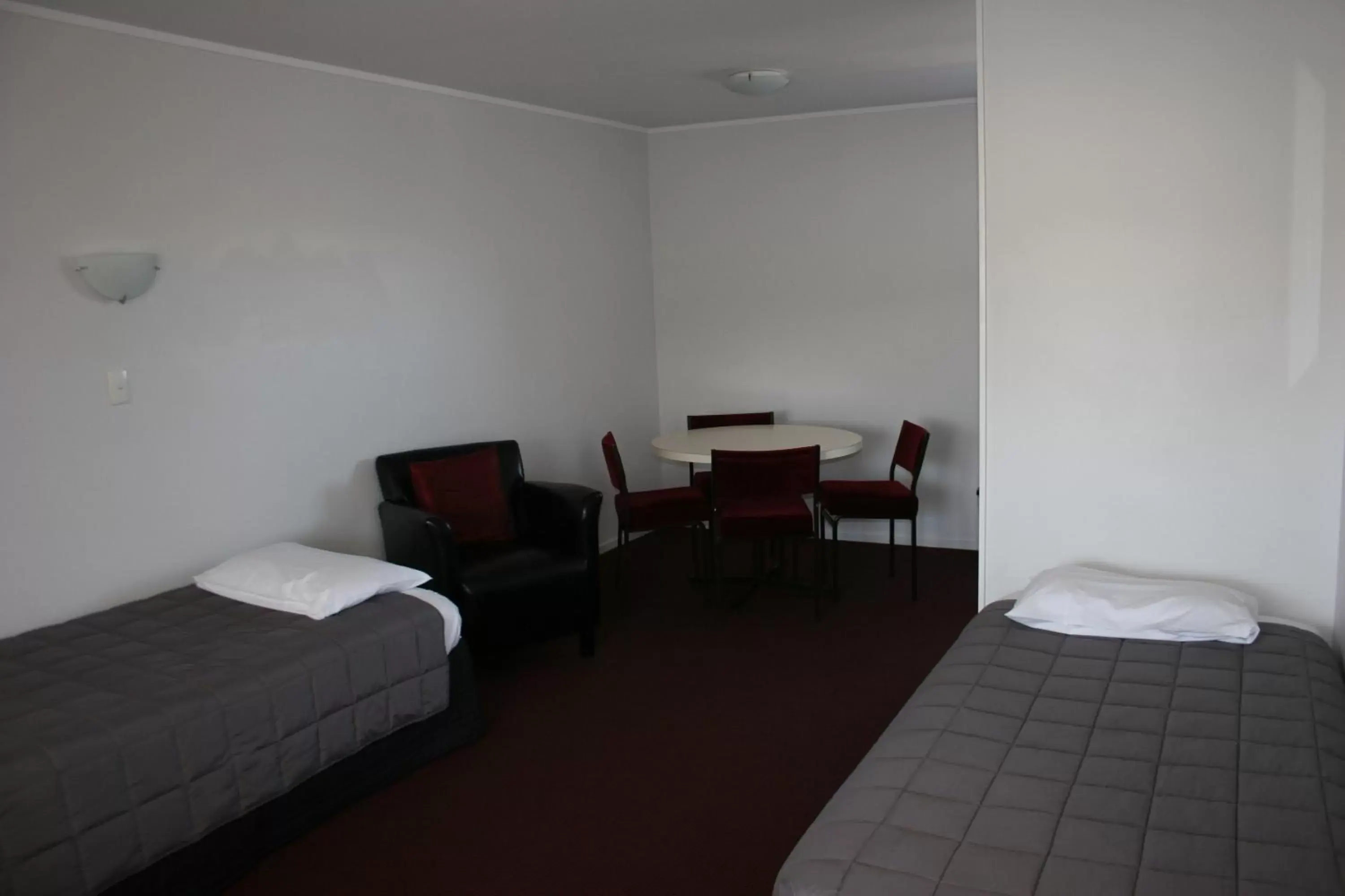 Photo of the whole room, Bed in Burgundy Rose Motel