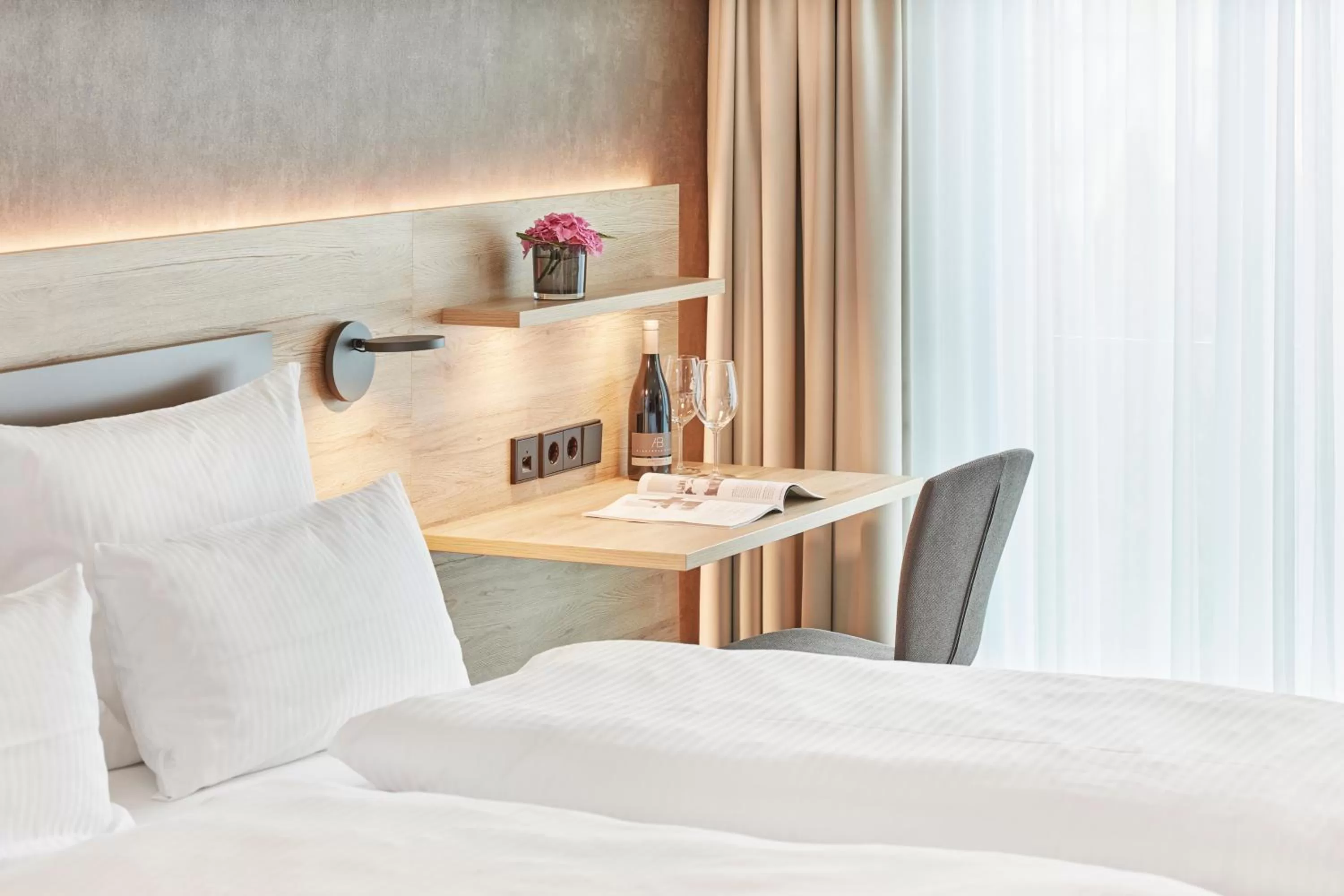 Bed in Gästehaus Bauer - Schlafen auf dem Weingut