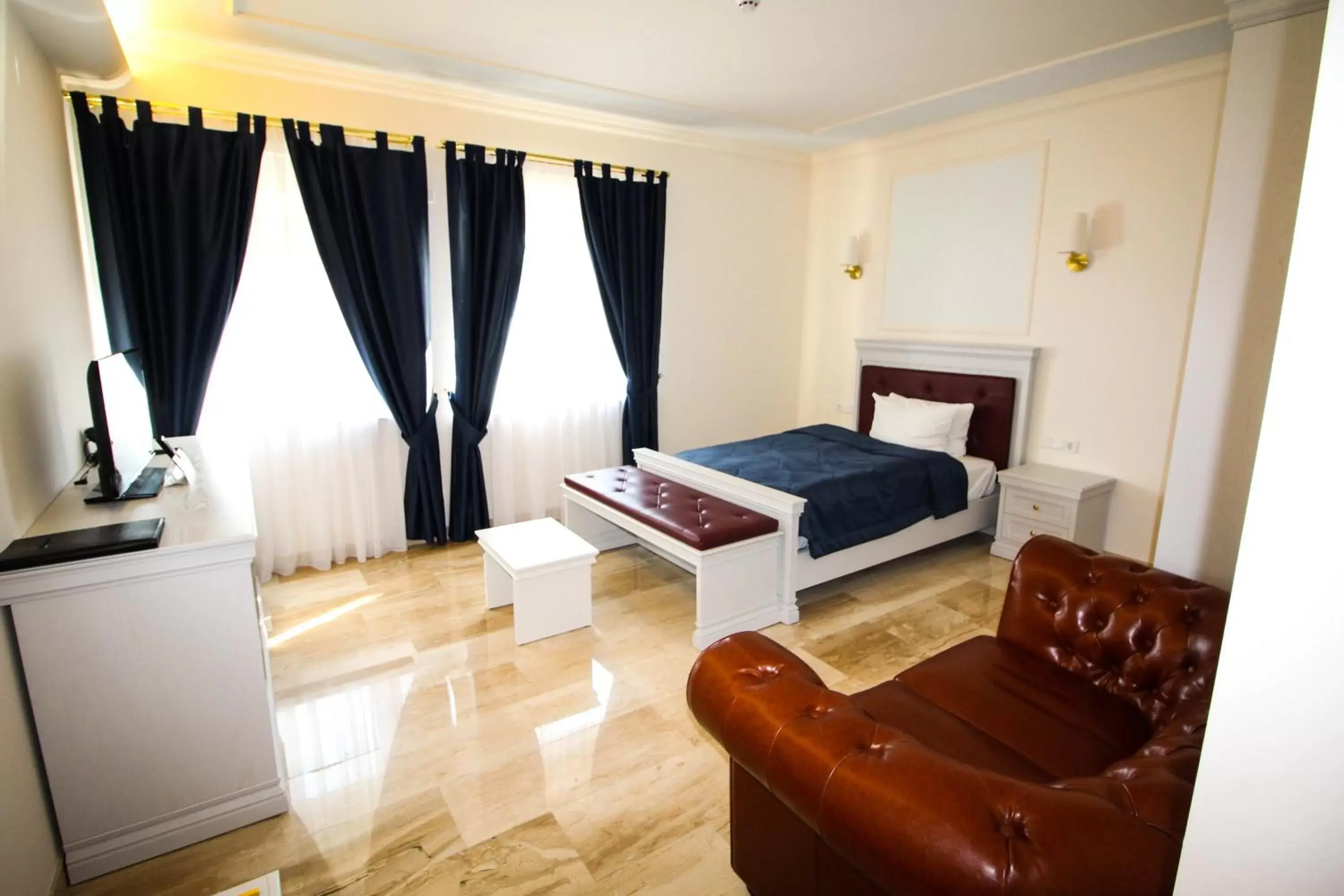 Bed, Seating Area in Grand Hotel Palladium