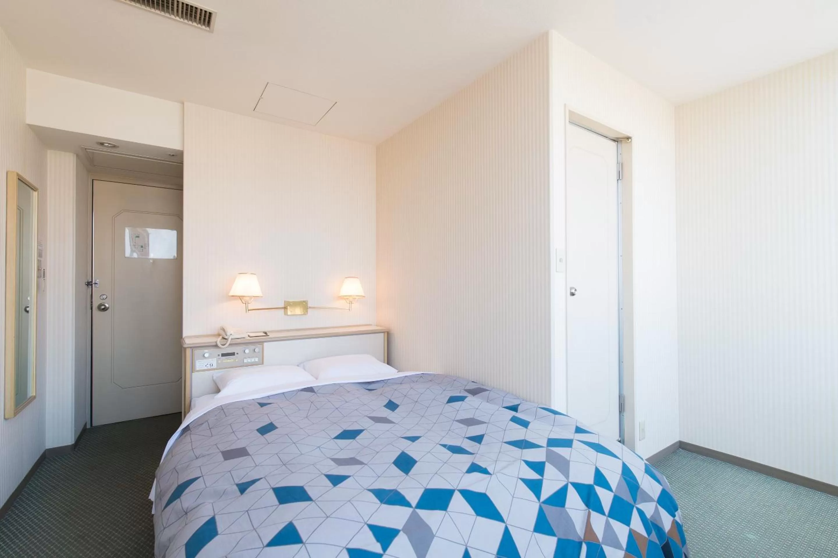 Photo of the whole room, Bed in Tabist Hotel Tetora Kitakyushu