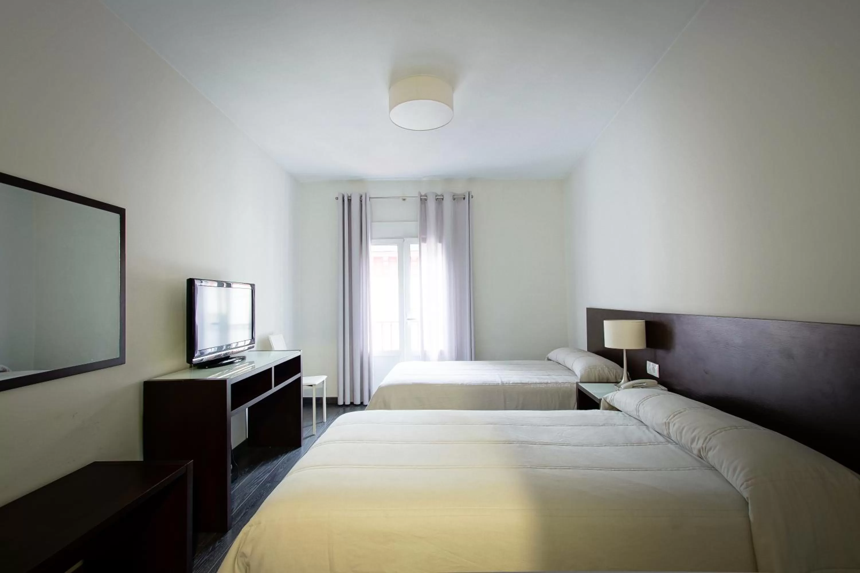 Bed in Hotel Madrid de Sevilla by SHS
