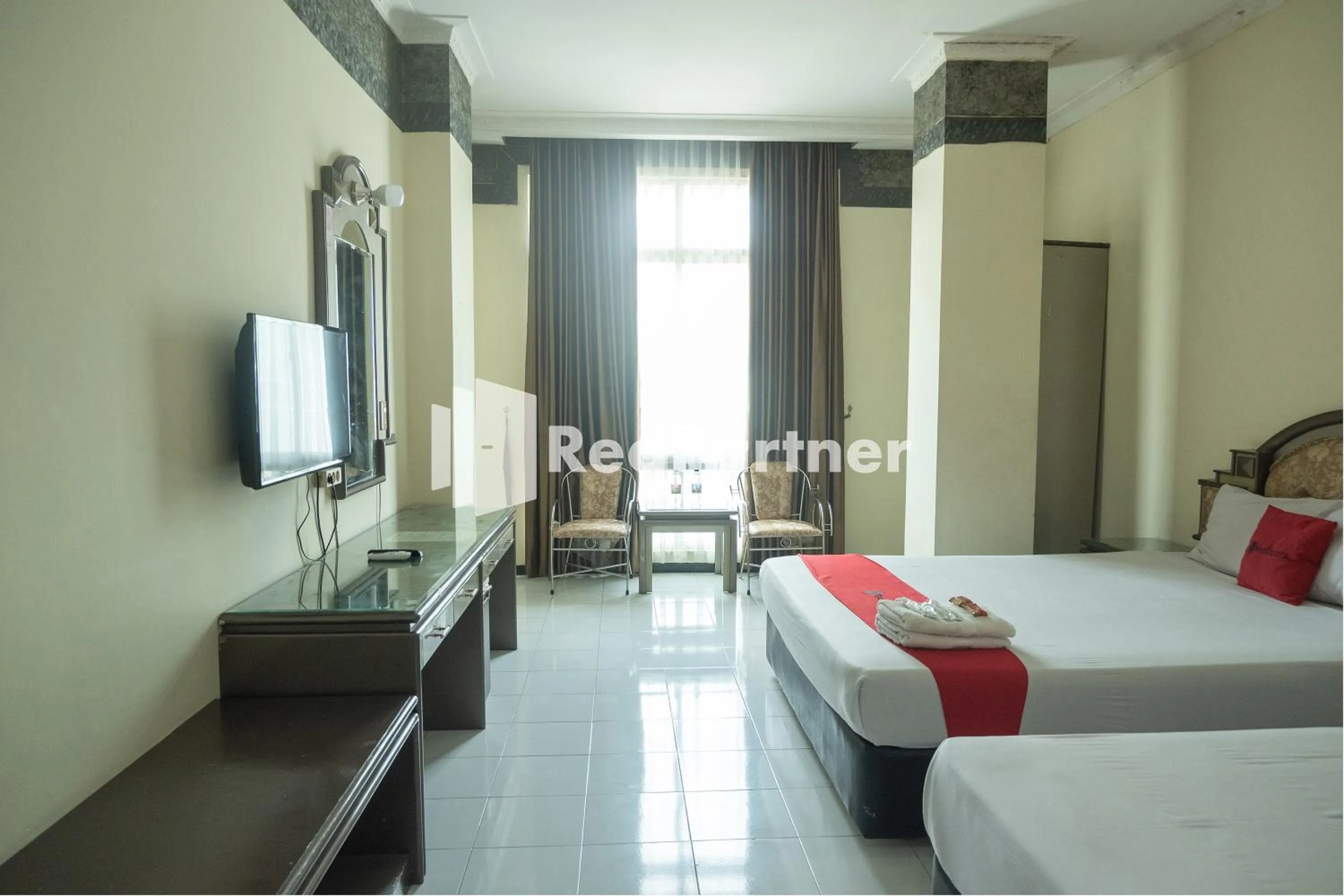 Bed in Akur Hotel Malioboro Mitra RedDoorz