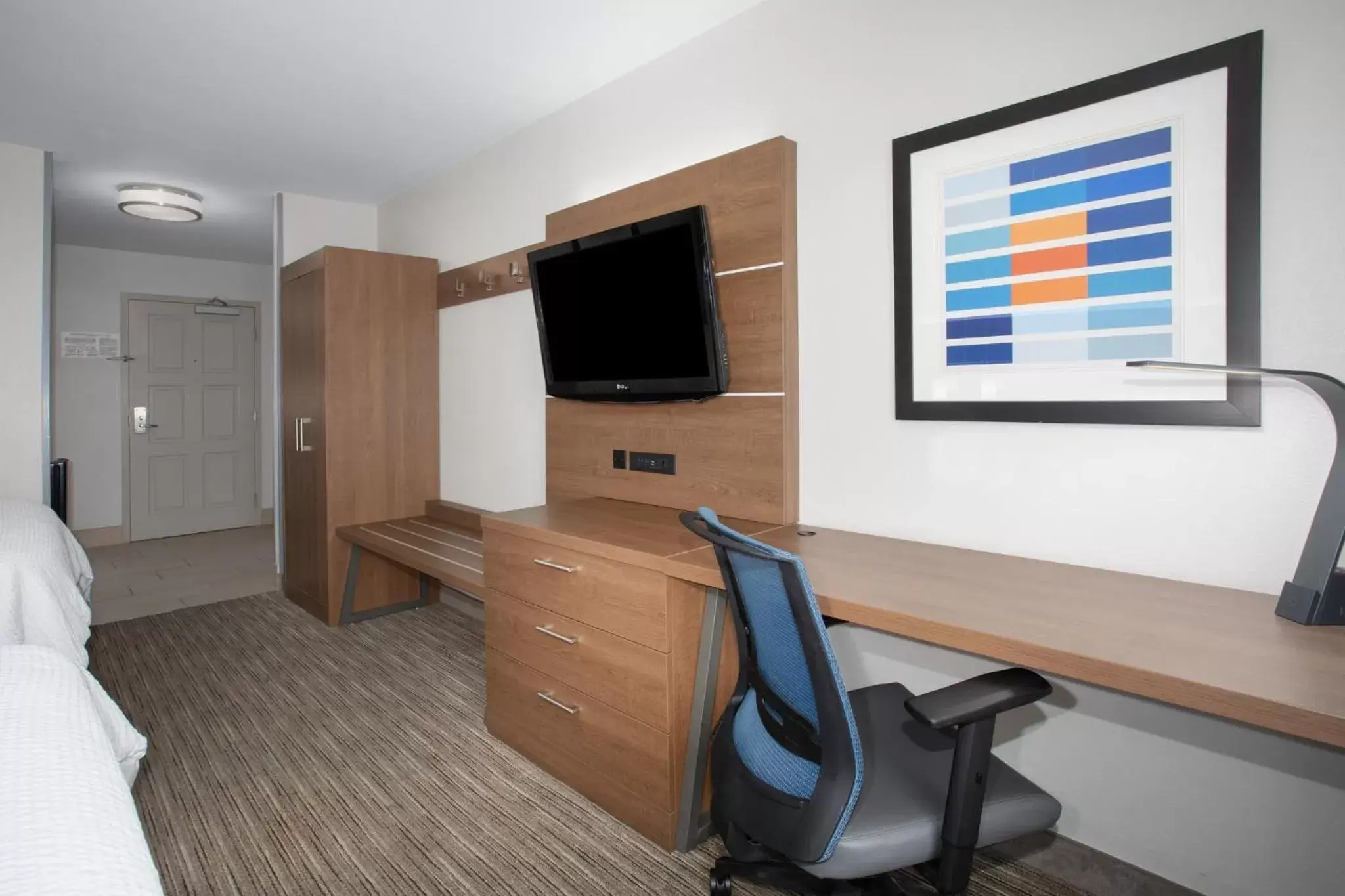 Photo of the whole room, TV/Entertainment Center in Holiday Inn Express & Suites Tucson, an IHG Hotel