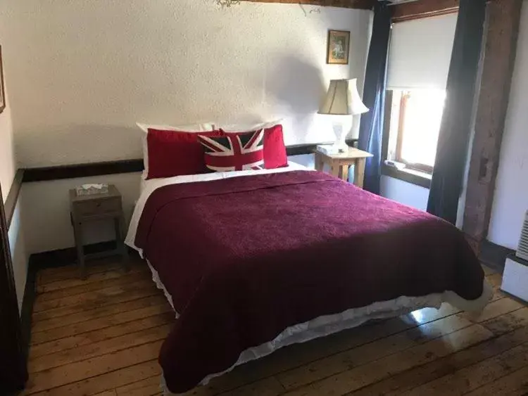 Bed in The Olde Angel Inn