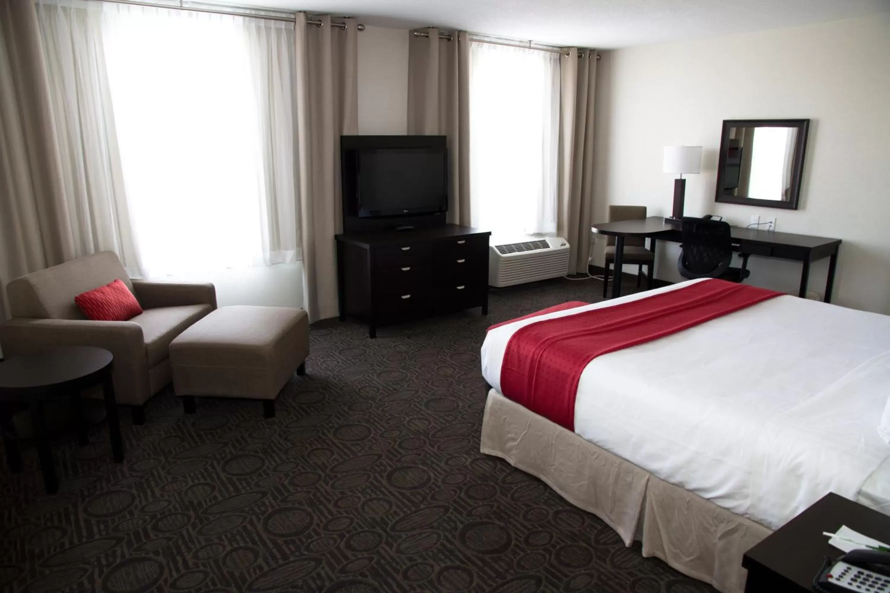 Photo of the whole room, TV/Entertainment Center in Holiday Inn Hotel & Suites Red Deer, an IHG Hotel