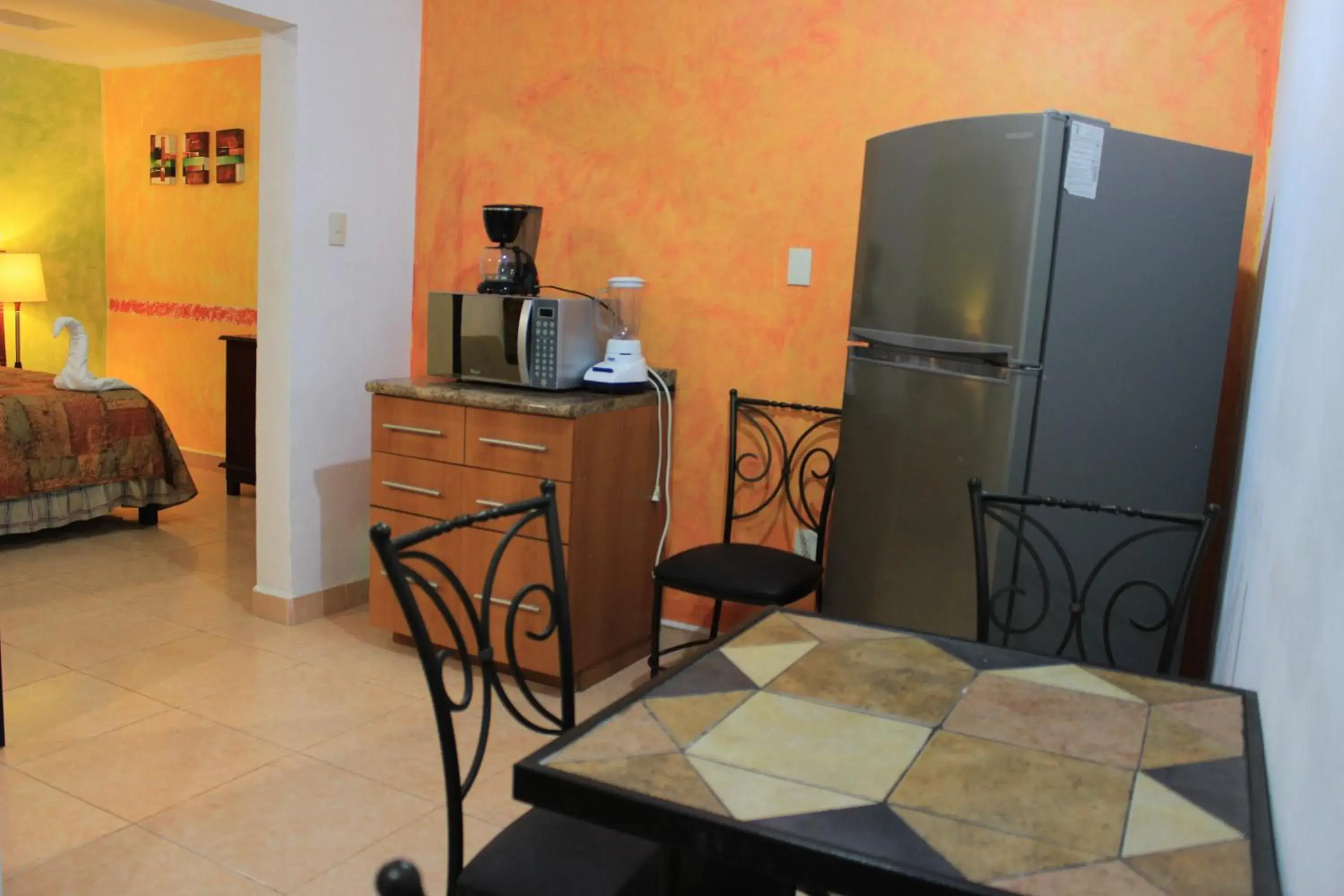 Dining area, TV/Entertainment Center in Terracota Corner Rooms